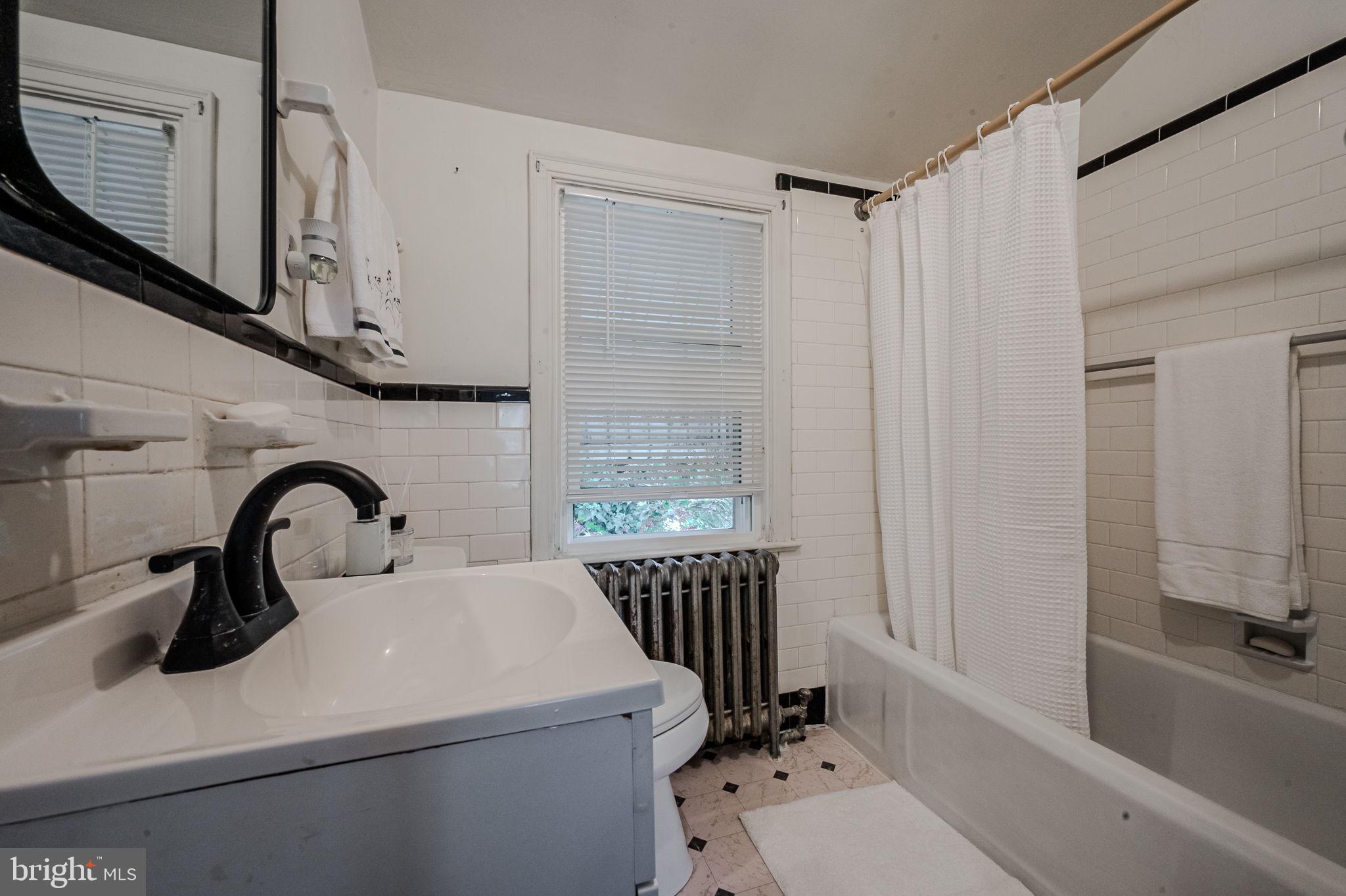 624 Gilbert Road Ridley Park, PA 19078 - Photo 18 of 36 a bathroom with a sink a toilet and a bathtub