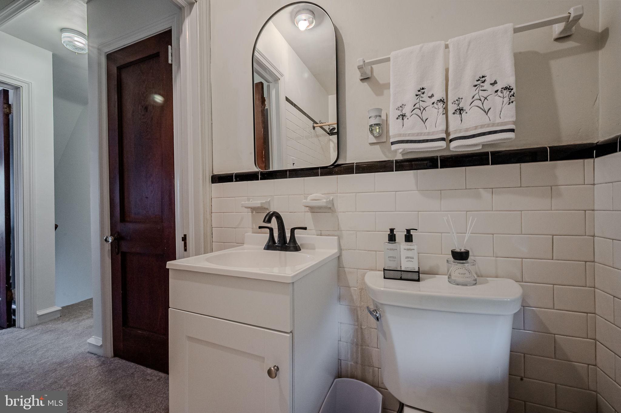624 Gilbert Road Ridley Park, PA 19078 - Photo 19 of 36 a bathroom with a sink and a mirror