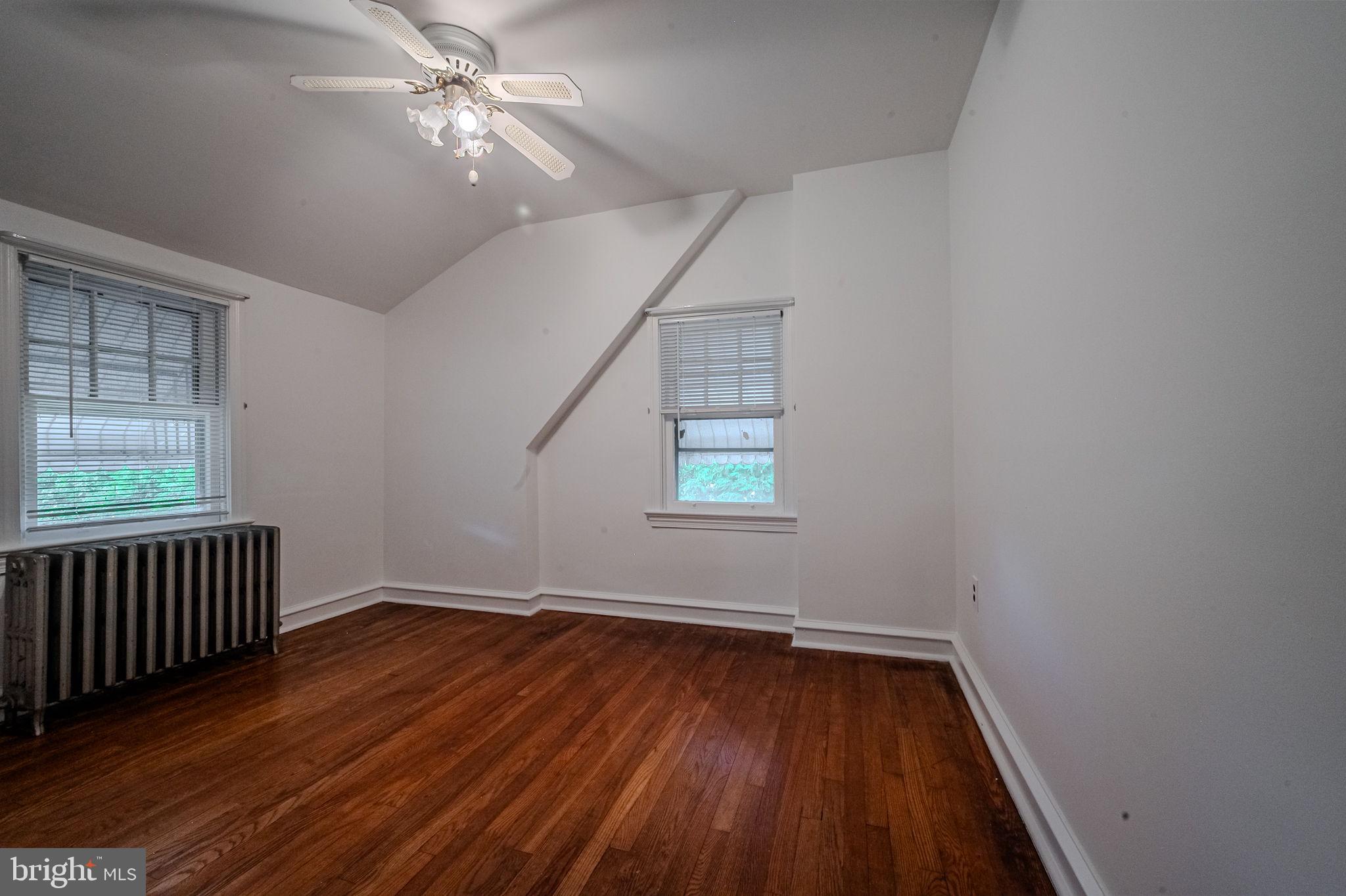 624 Gilbert Road Ridley Park, PA 19078 - Photo 20 of 36 wooden floor in an empty room with a window
