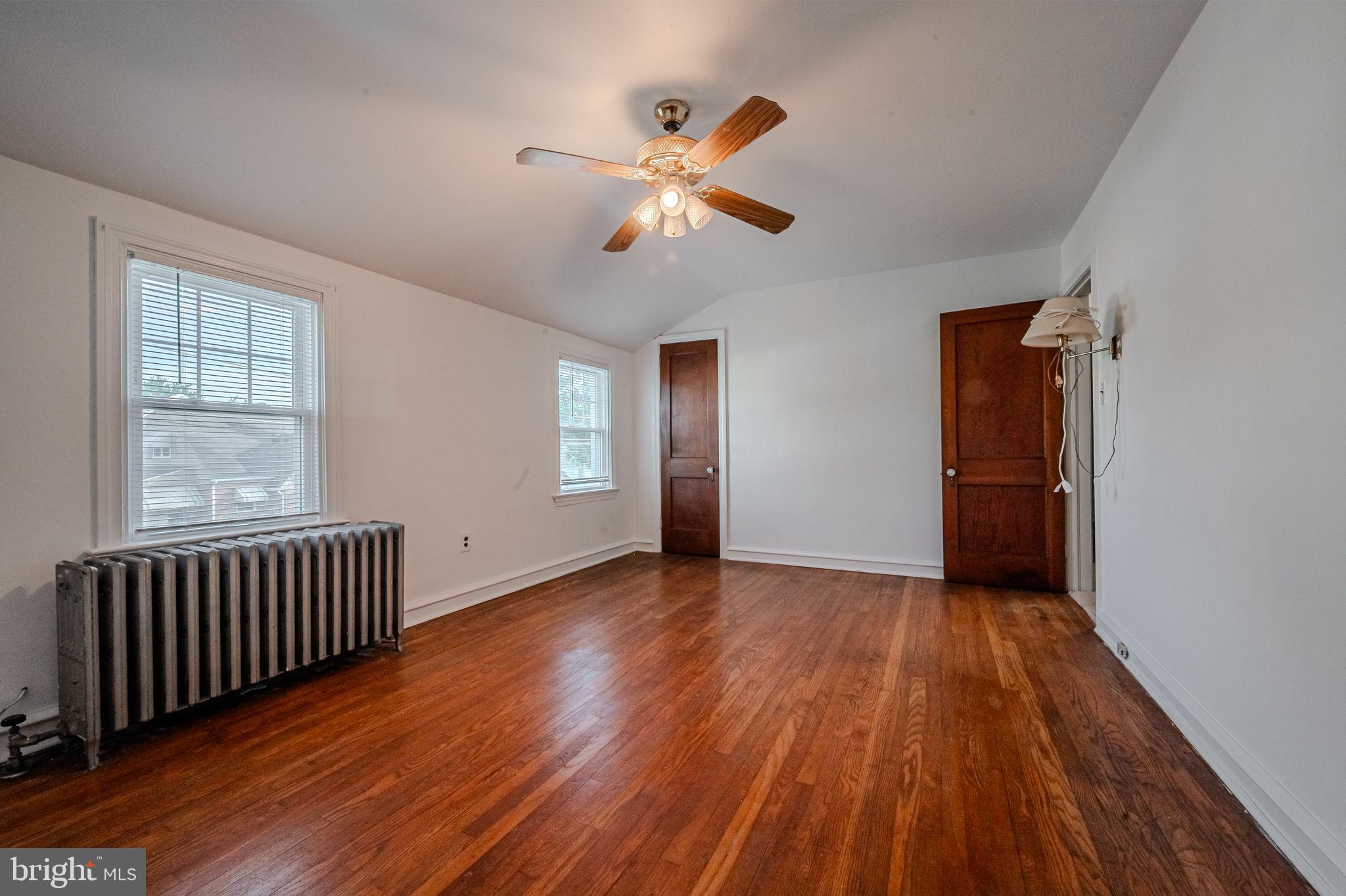 624 Gilbert Road Ridley Park, PA 19078 - Photo 25 of 36 wooden floor in an empty room with a window