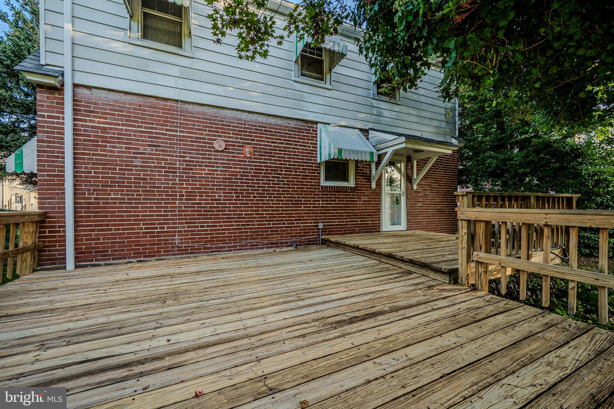 624 Gilbert Road Ridley Park, PA 19078 - Photo 32 of 36 a backyard of a house with wooden floor and fence