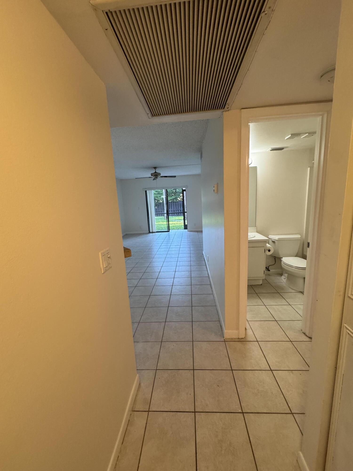 21890 Lake Forest Circle, Unit 102 Boca Raton, FL 33433 - Photo 14 of 24 a bathroom with a sink and a mirror