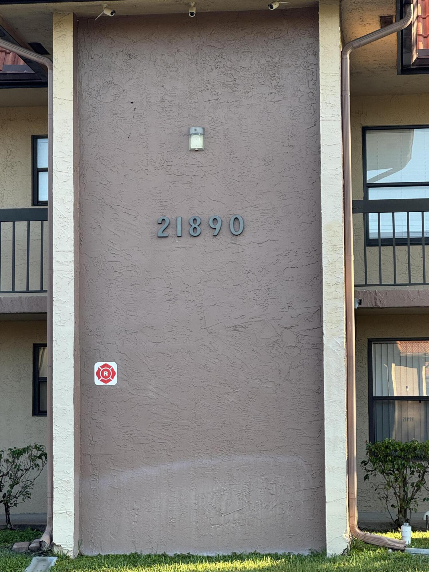 21890 Lake Forest Circle, Unit 102 Boca Raton, FL 33433 - Photo 18 of 24 a front view of a house with glass windows