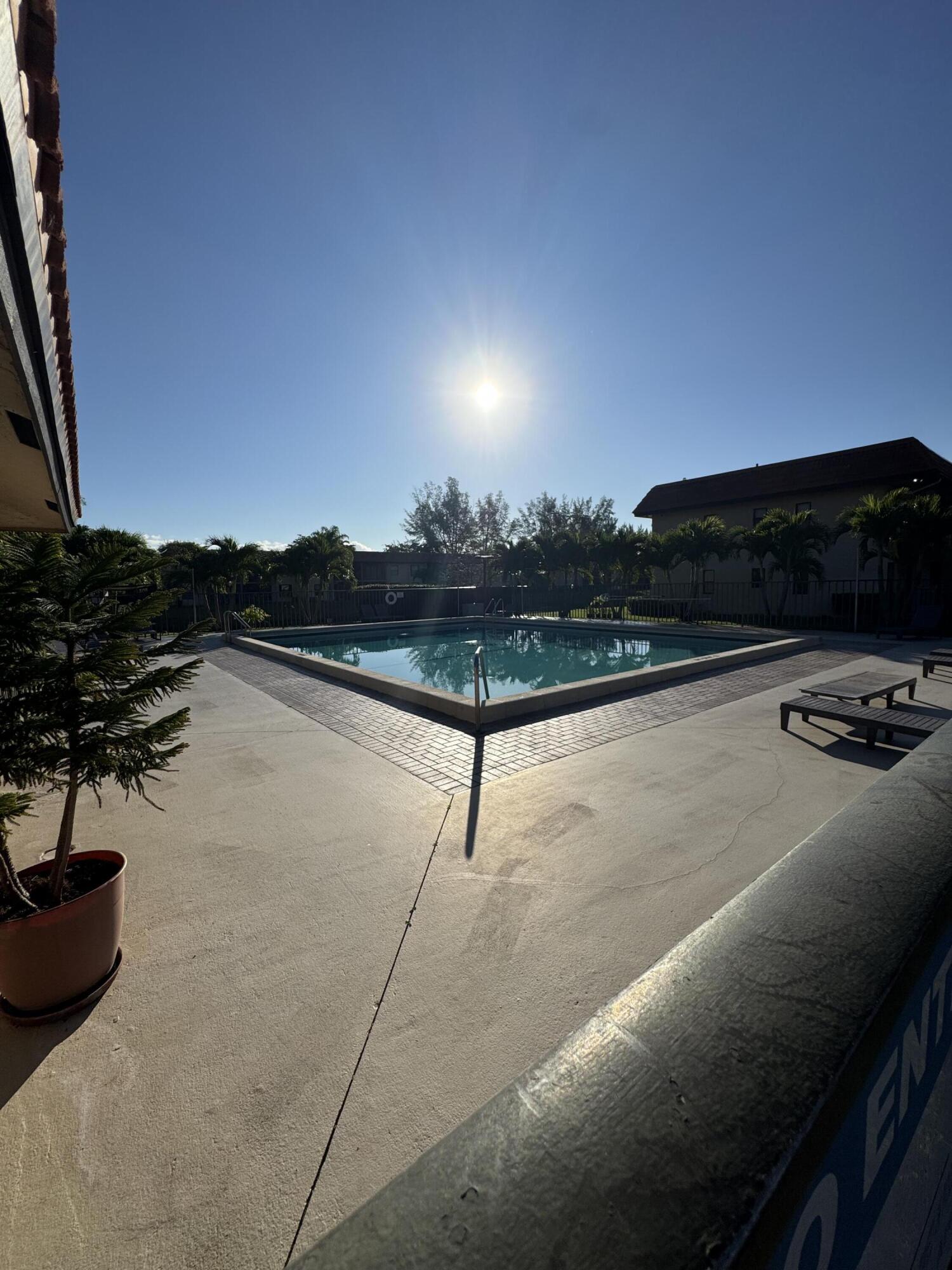 21890 Lake Forest Circle, Unit 102 Boca Raton, FL 33433 - Photo 19 of 24 a view of swimming pool from balcony