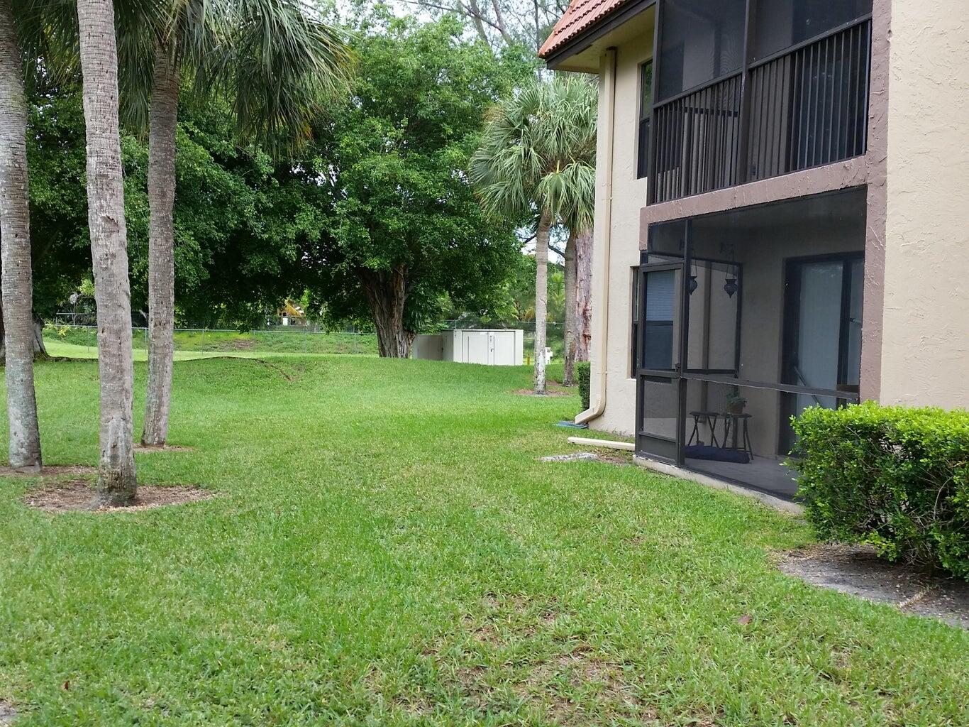 21890 Lake Forest Circle, Unit 102 Boca Raton, FL 33433 - Photo 21 of 24 a view of a back yard of the house