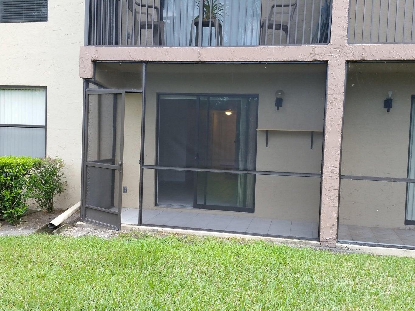 21890 Lake Forest Circle, Unit 102 Boca Raton, FL 33433 - Photo 22 of 24 a view of an outdoor space