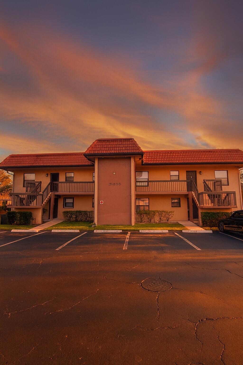 21890 Lake Forest Circle, Unit 102 Boca Raton, FL 33433 - Photo 3 of 24 a view of street with parked cars