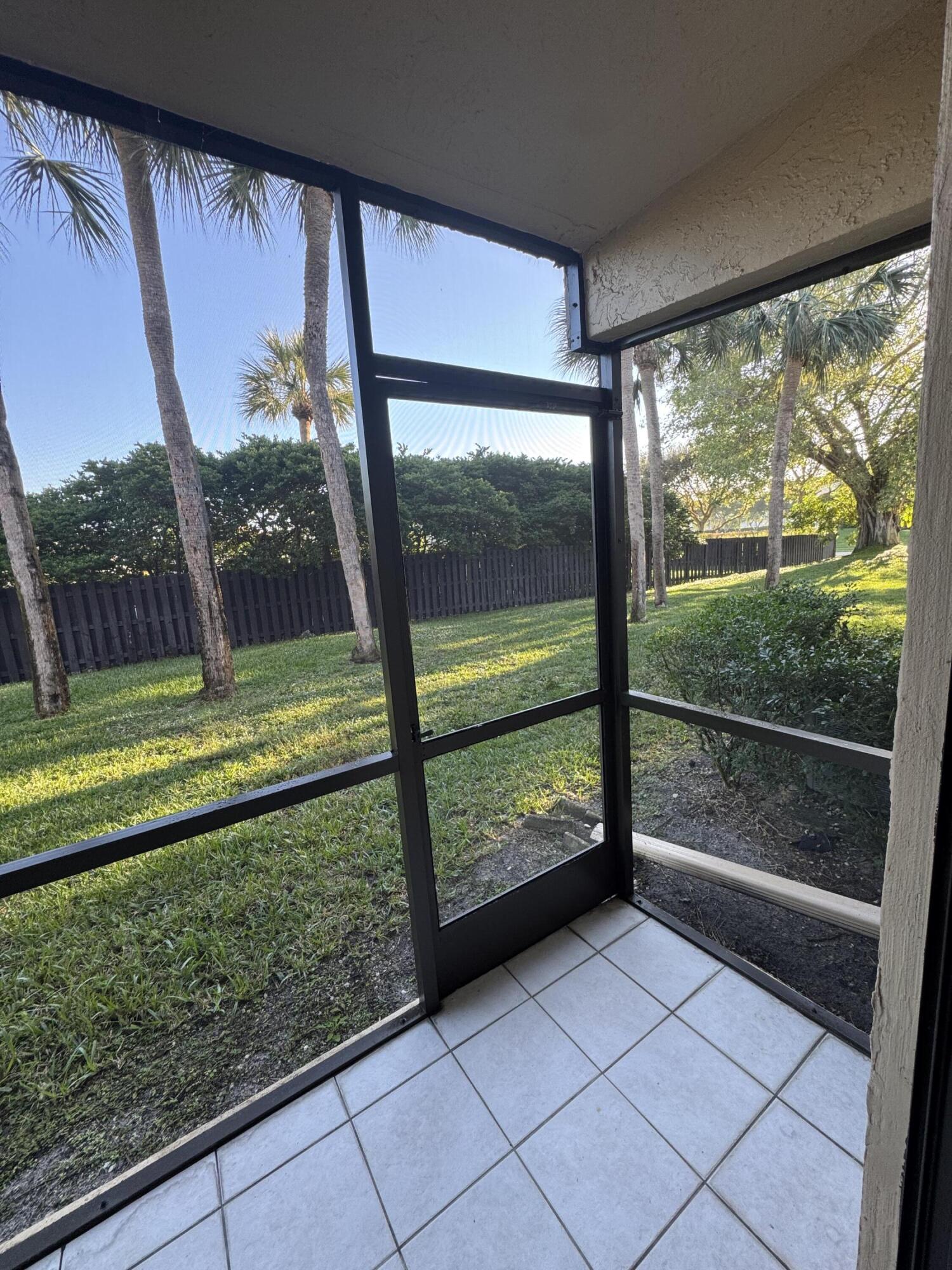 21890 Lake Forest Circle, Unit 102 Boca Raton, FL 33433 - Photo 8 of 24 a view of outdoor space with a large window