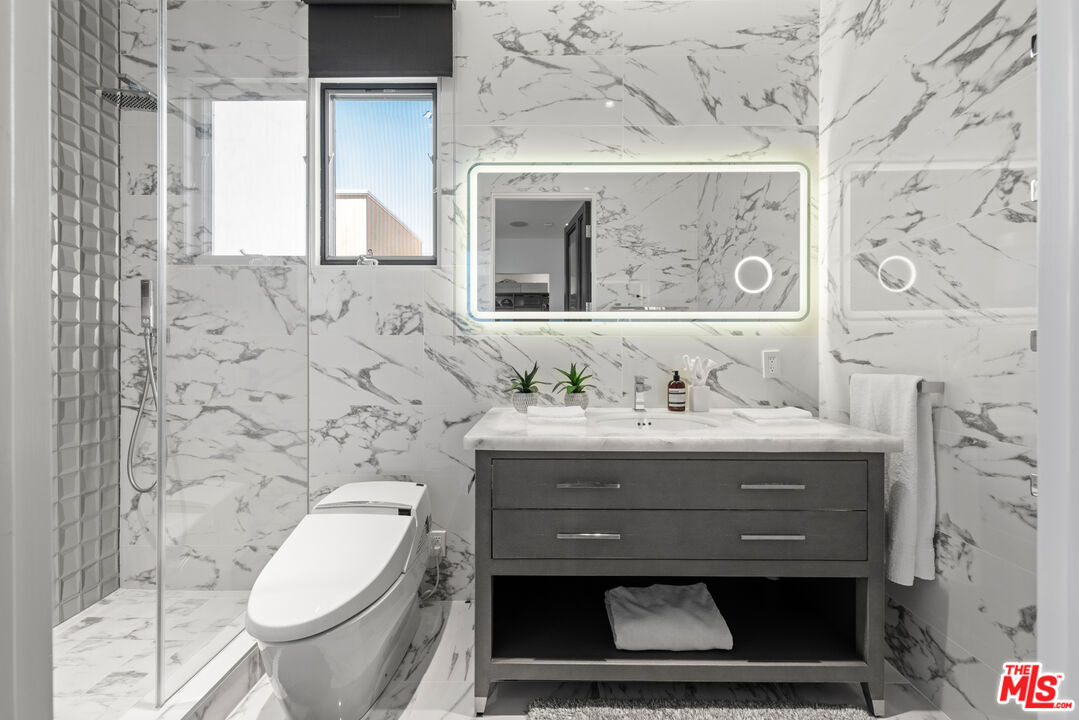 145 Channel Pointe Mall Marina del Rey, CA 90292 - Photo 37 of 75 a bathroom with a sink a toilet and a shower