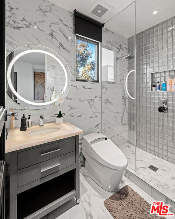 145 Channel Pointe Mall Marina del Rey, CA 90292 - Photo 39 of 75 a bathroom with a sink toilet and shower