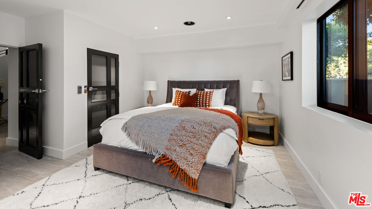 145 Channel Pointe Mall Marina del Rey, CA 90292 - Photo 41 of 75 a bedroom with a bed and a refrigerator