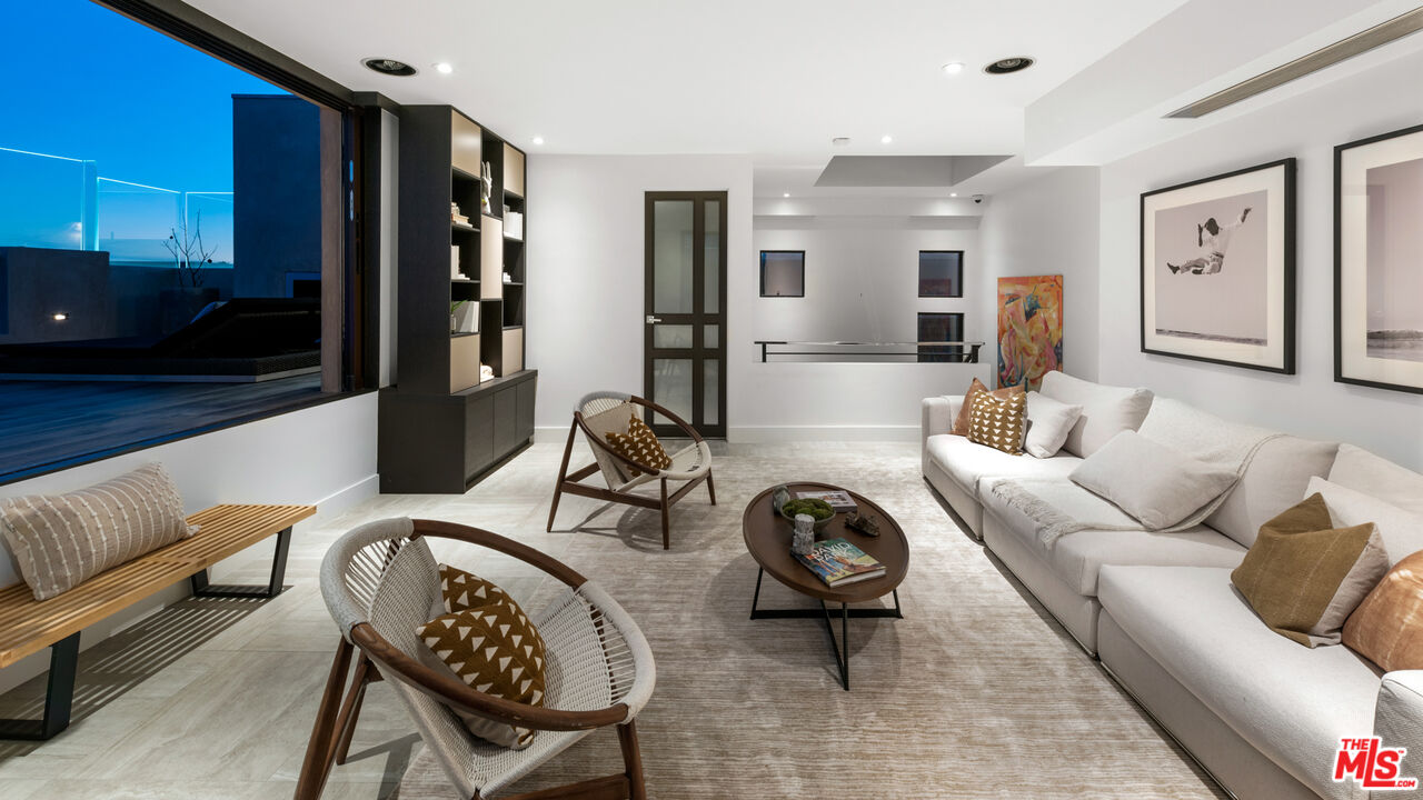 145 Channel Pointe Mall Marina del Rey, CA 90292 - Photo 48 of 75 a living room with furniture a rug and kitchen view