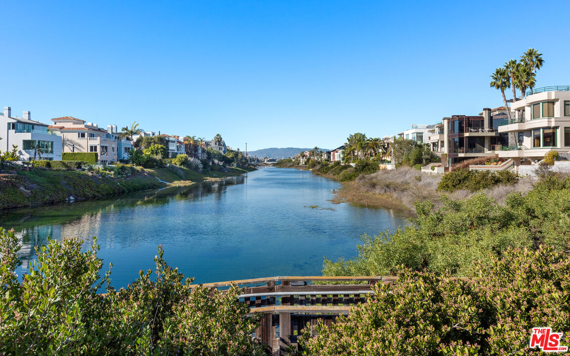 145 Channel Pointe Mall Marina del Rey, CA 90292 - Photo 75 of 75 a view of a lake with a yard and large trees