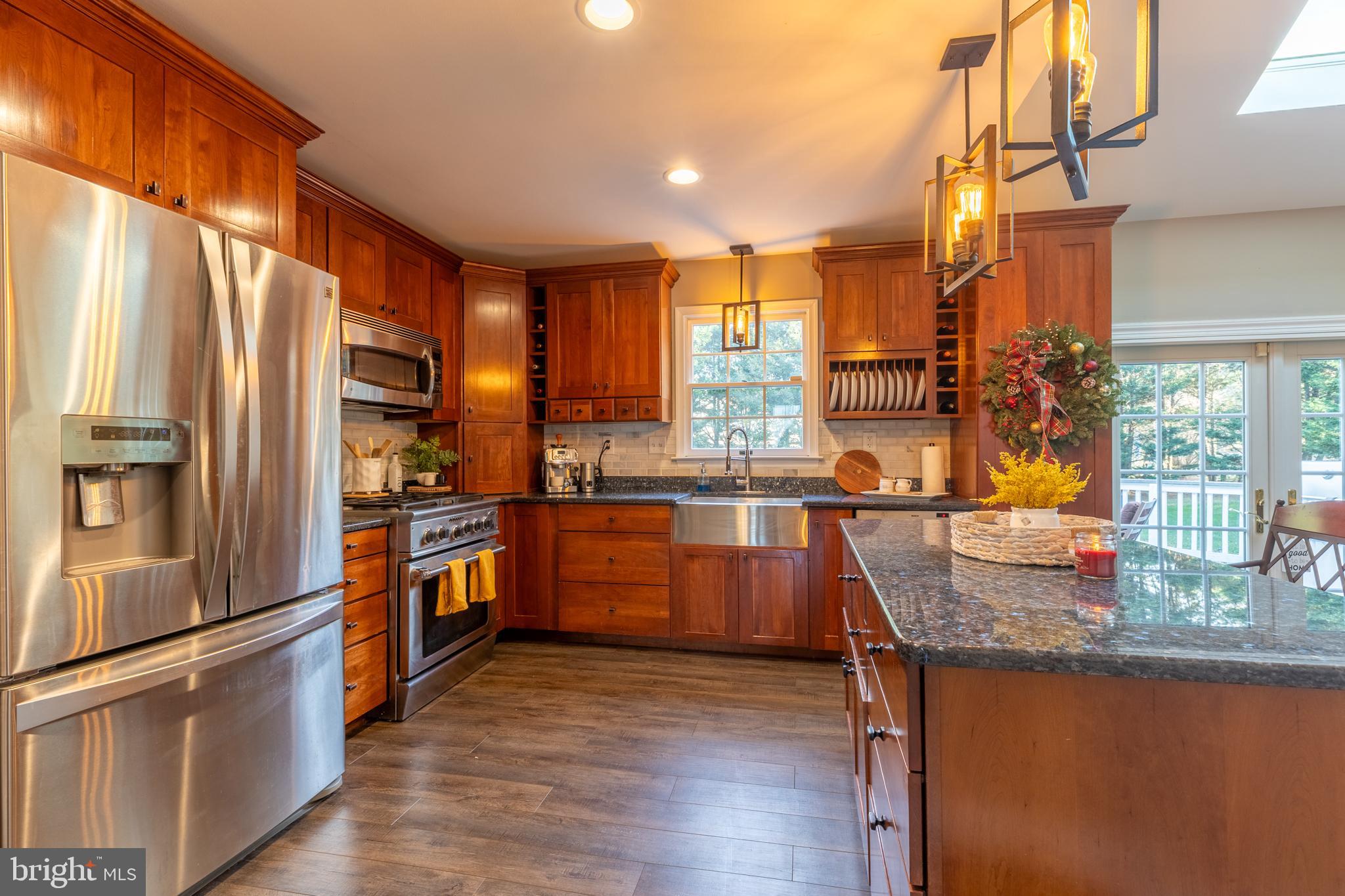 3 Heatherstone Way Hockessin, DE 19707 - Photo 5 of 29 a kitchen with granite countertop lots of counter top space and stainless steel appliances