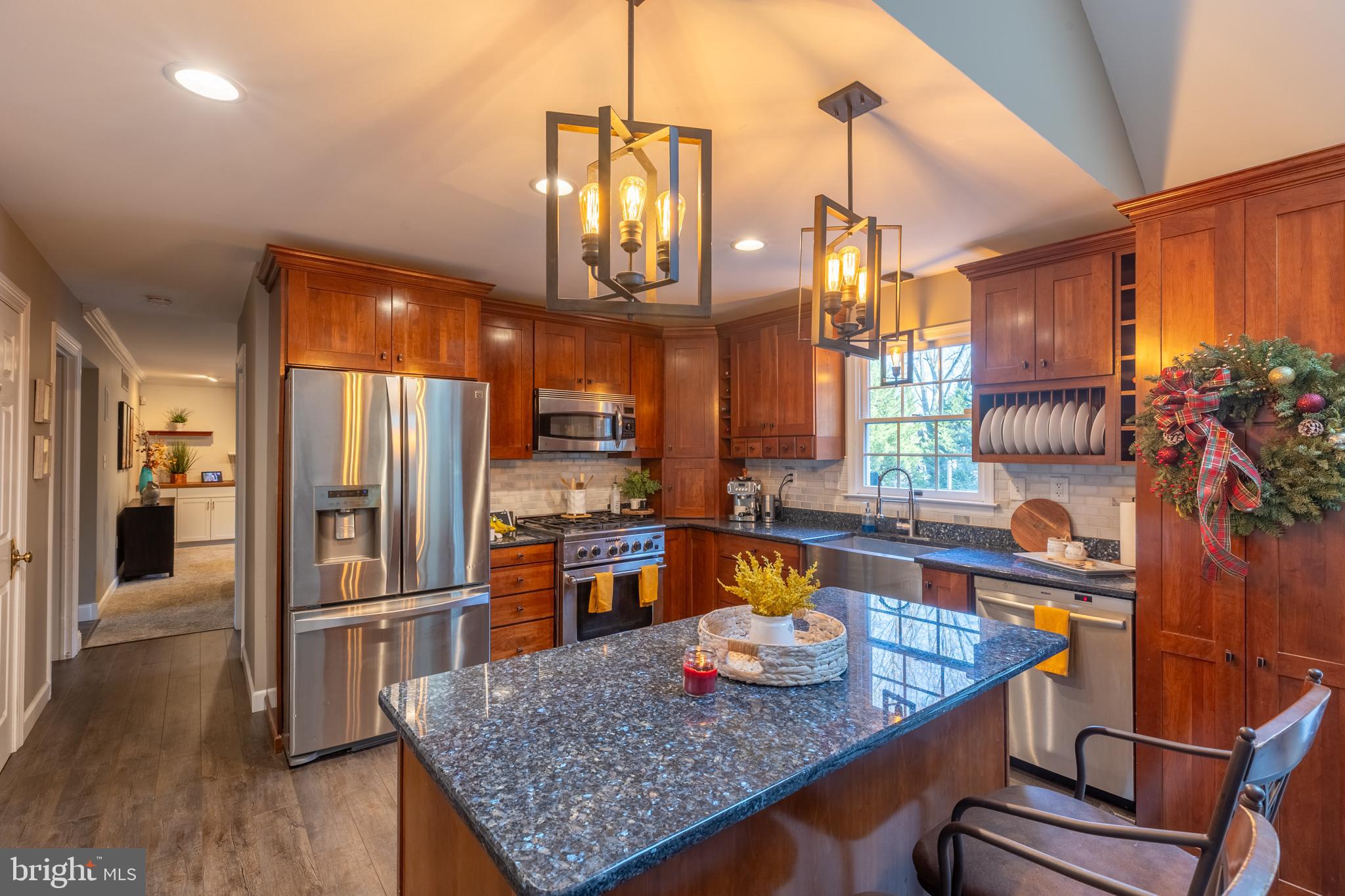 3 Heatherstone Way Hockessin, DE 19707 - Photo 6 of 29 a kitchen with stainless steel appliances granite countertop a sink refrigerator and cabinets