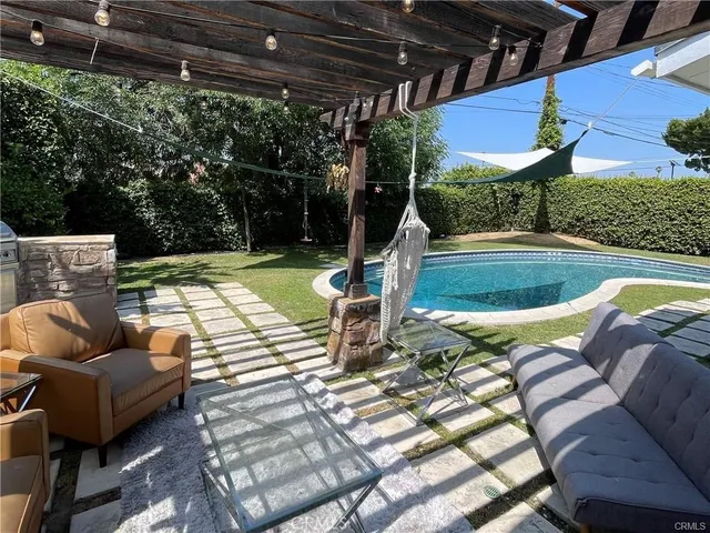 a view of swimming pool with a patio