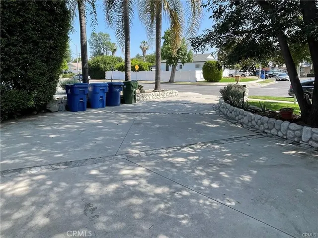 a view of backyard with swimming pool