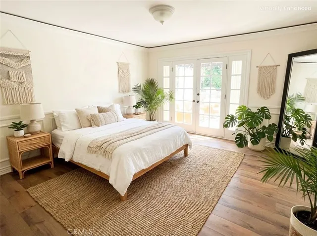a spacious bedroom with a balcony a bed and a couch
