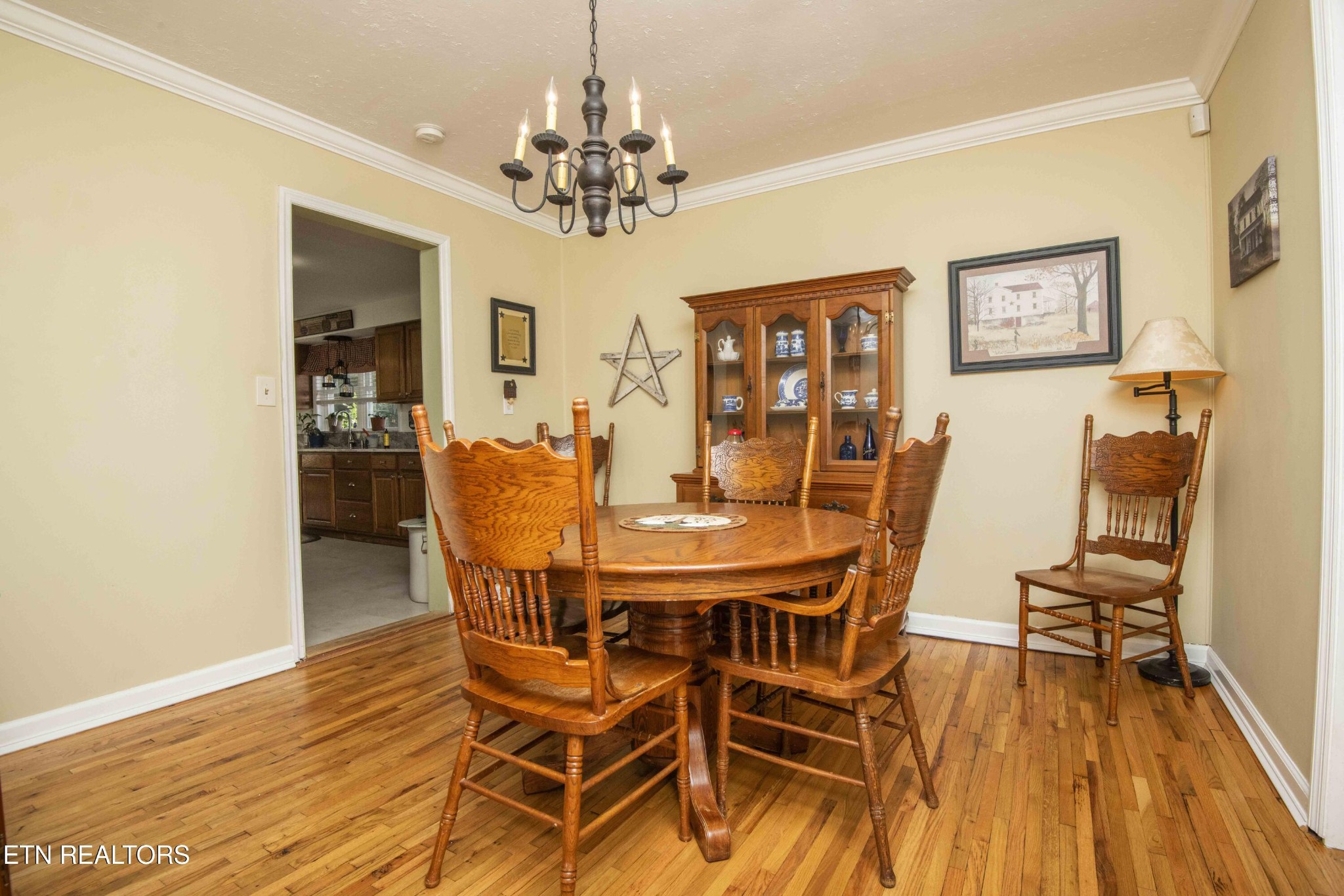 651 Hines Valley Road Lenoir City, TN 37771 - Photo 11 of 44 a view of a dining room with furniture wooden floor and chandelier