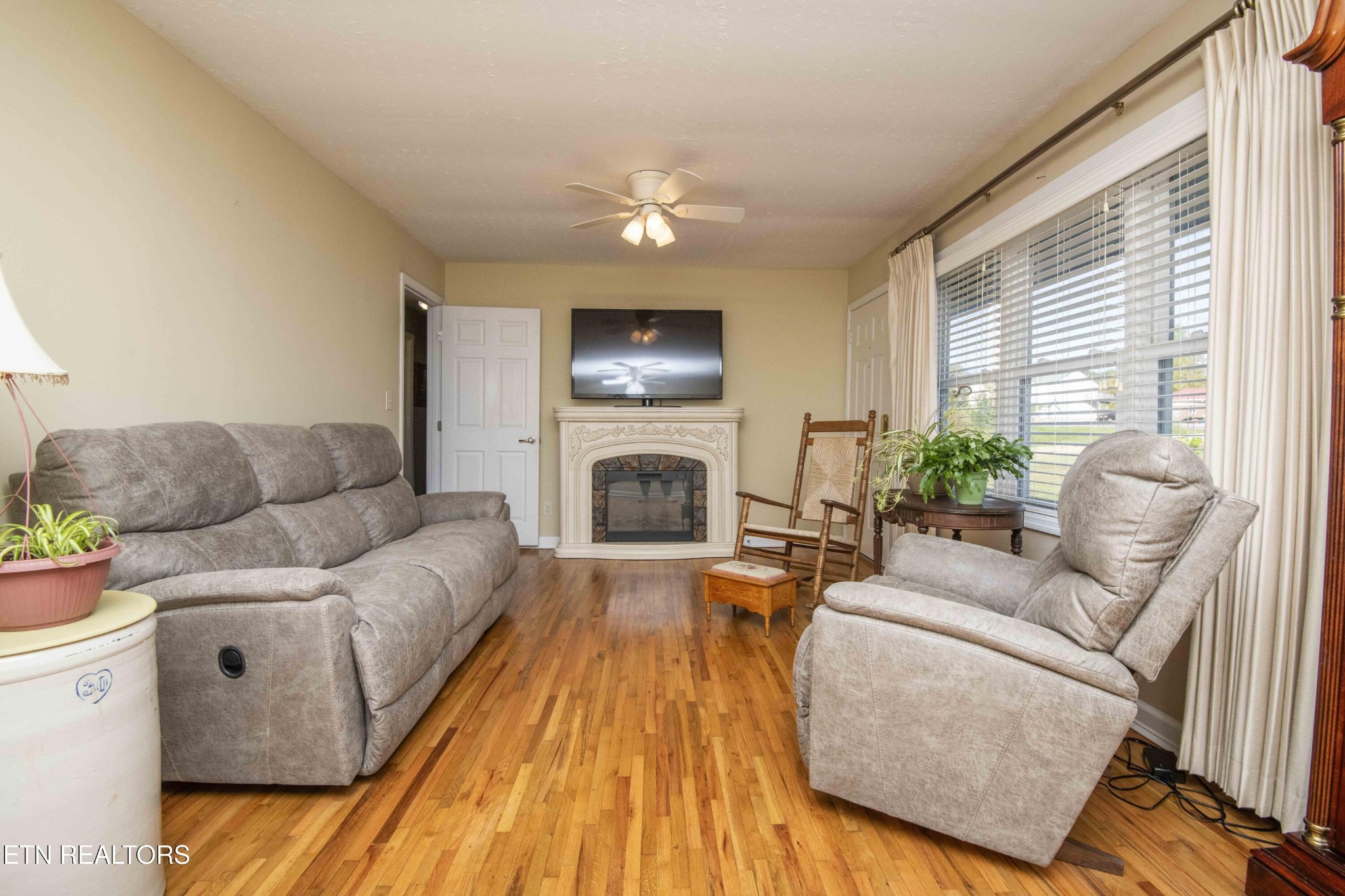 651 Hines Valley Road Lenoir City, TN 37771 - Photo 12 of 44 a living room with furniture and a fireplace