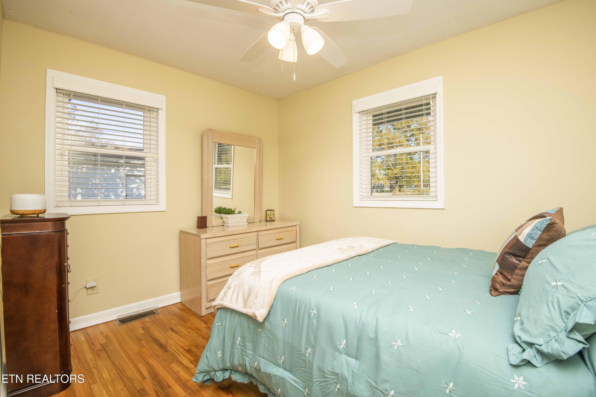 651 Hines Valley Road Lenoir City, TN 37771 - Photo 17 of 44 a bedroom with a bed and a window