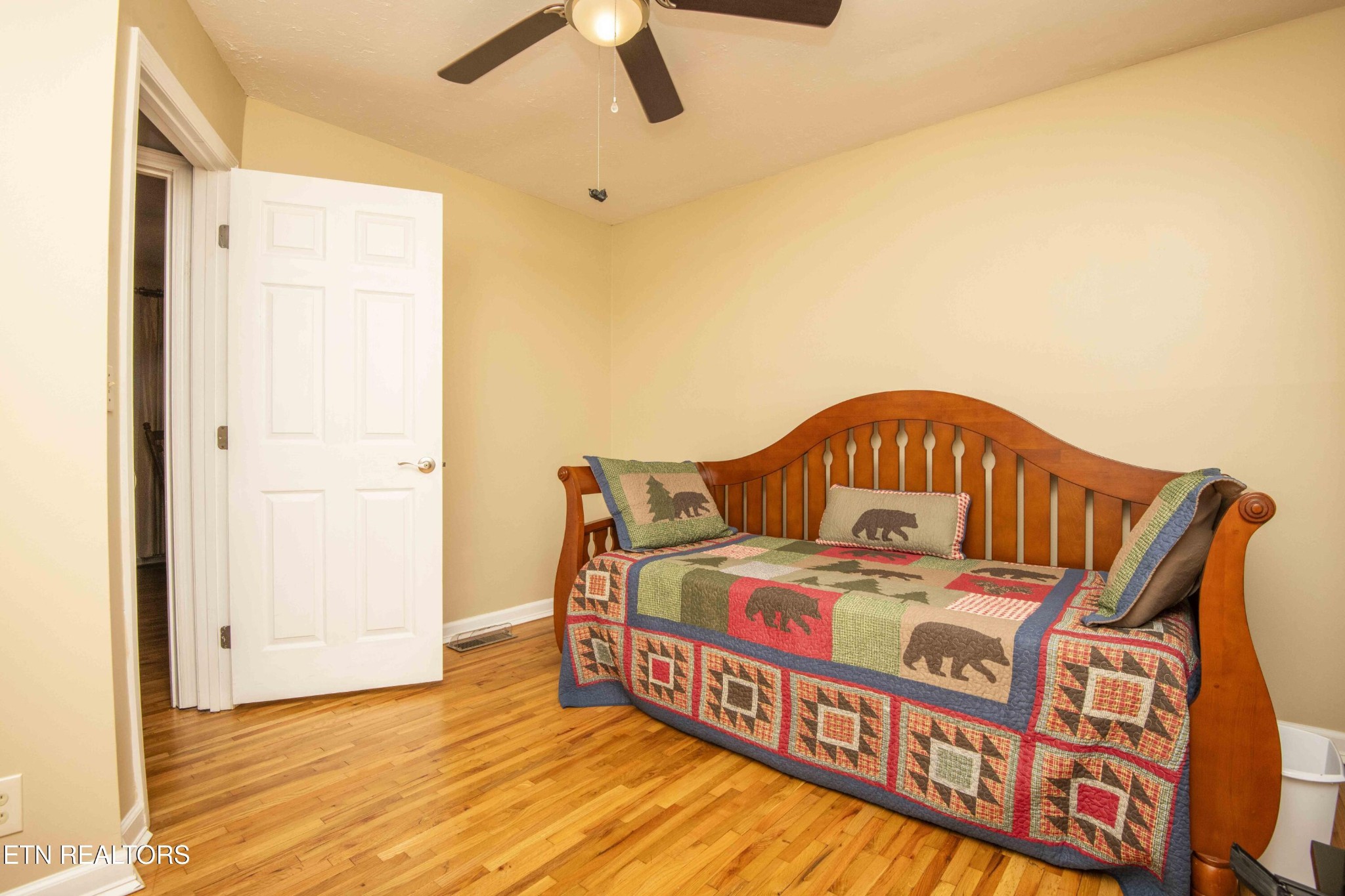 651 Hines Valley Road Lenoir City, TN 37771 - Photo 22 of 44 a bedroom with a bed next to a window