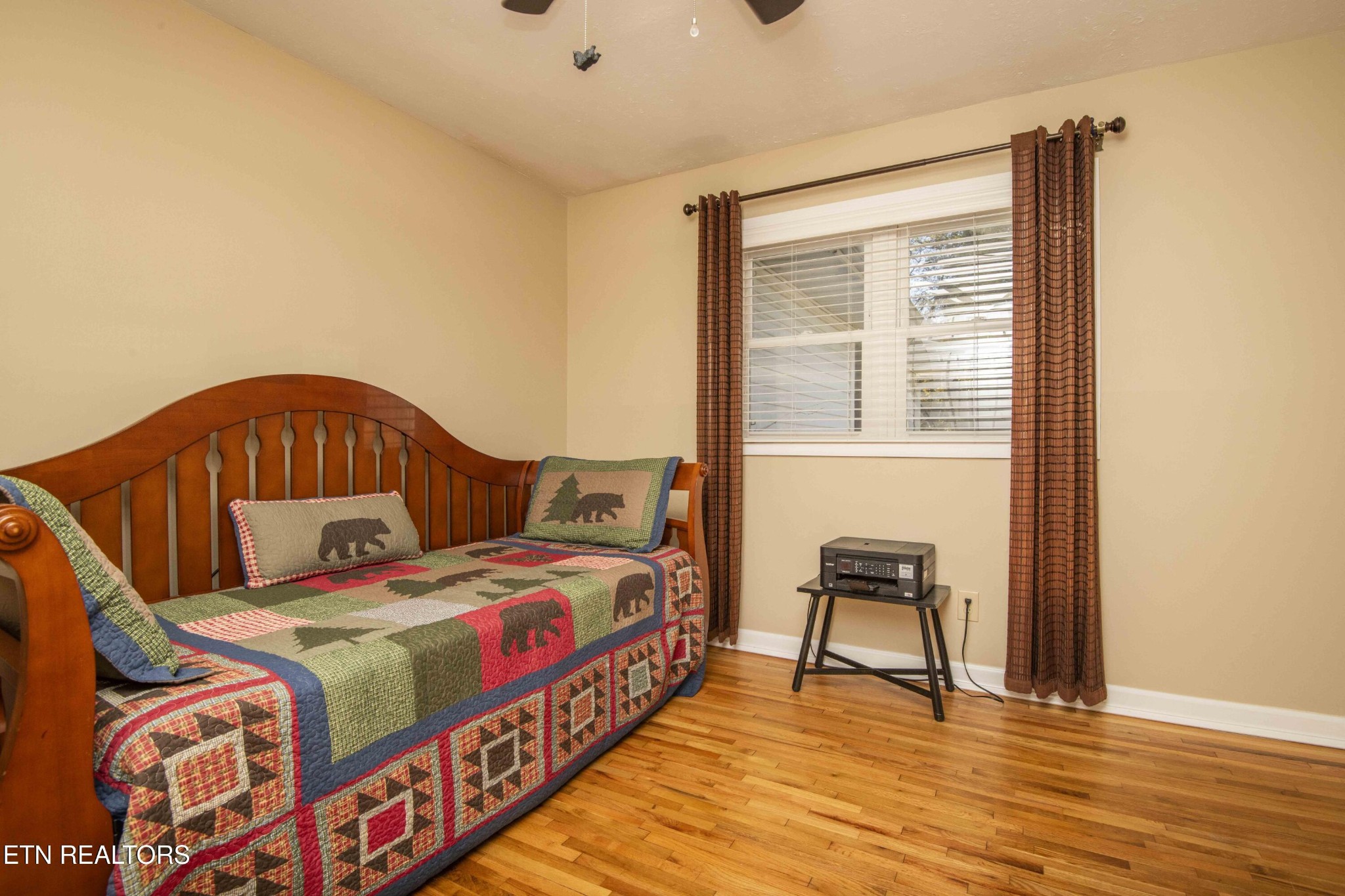 651 Hines Valley Road Lenoir City, TN 37771 - Photo 23 of 44 a bedroom with a bed and a chair