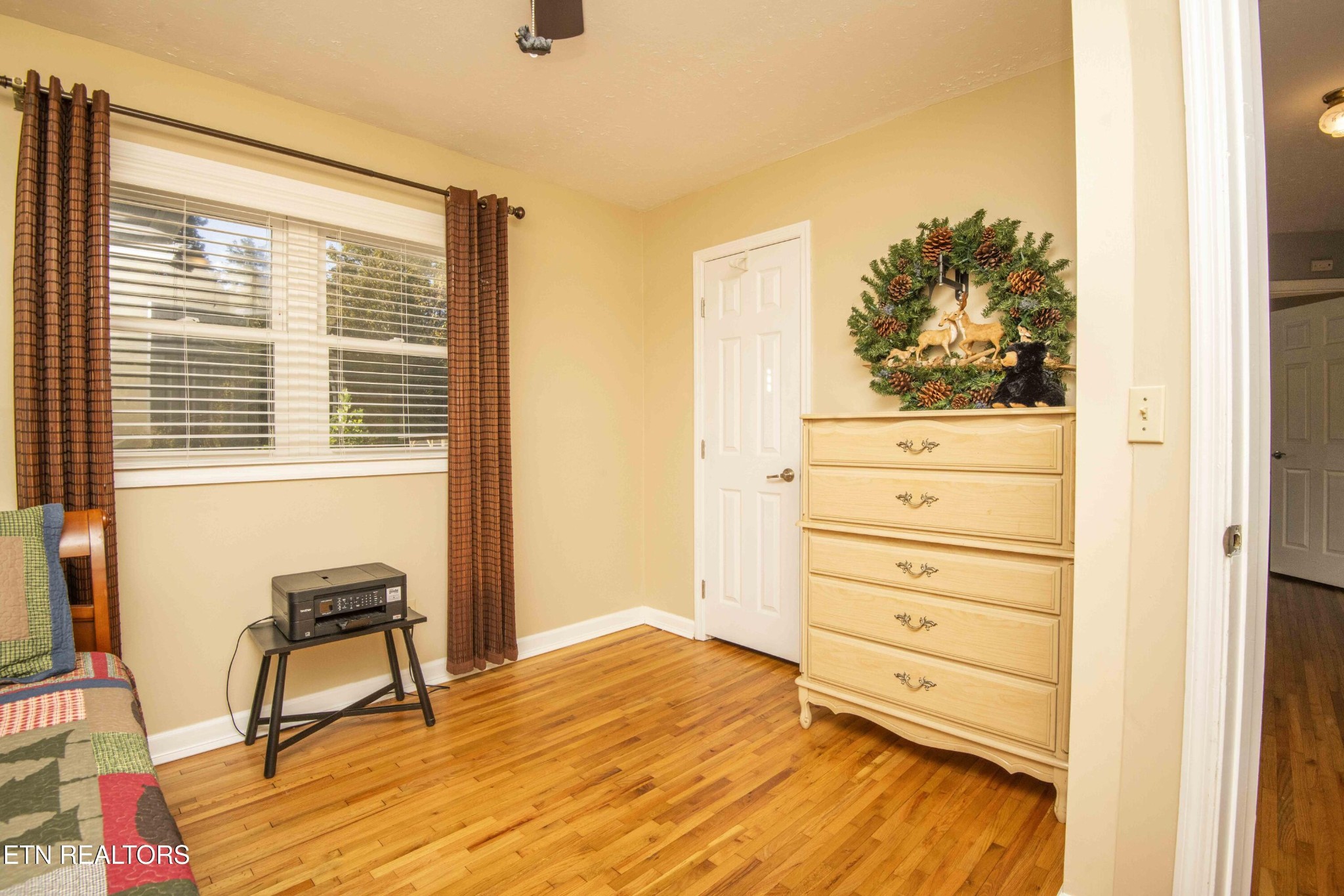651 Hines Valley Road Lenoir City, TN 37771 - Photo 24 of 44 a view of a bedroom with a bed and a window