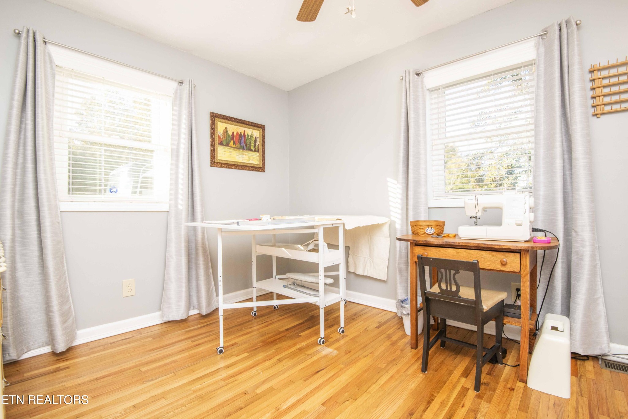 651 Hines Valley Road Lenoir City, TN 37771 - Photo 25 of 44 a dining room with wooden floor and a window