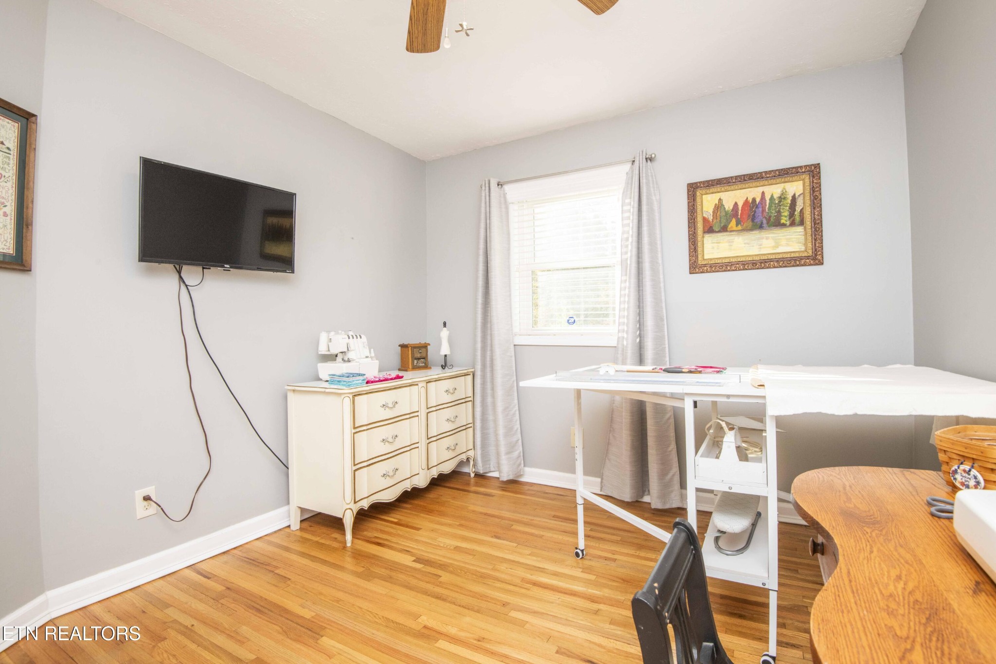 651 Hines Valley Road Lenoir City, TN 37771 - Photo 26 of 44 a living room with furniture and a flat screen tv