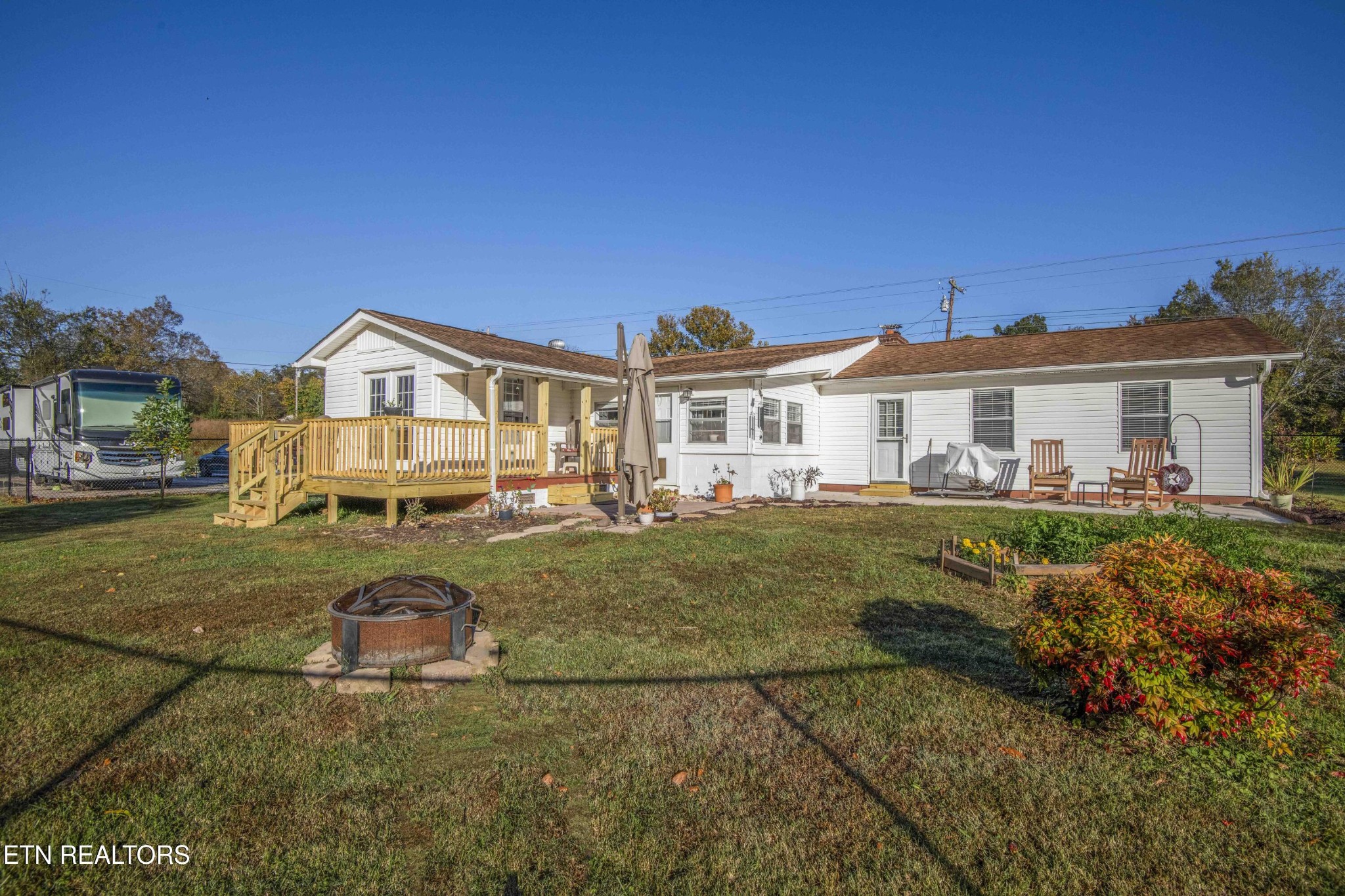 651 Hines Valley Road Lenoir City, TN 37771 - Photo 31 of 44 a view of a big house with a big yard and large trees