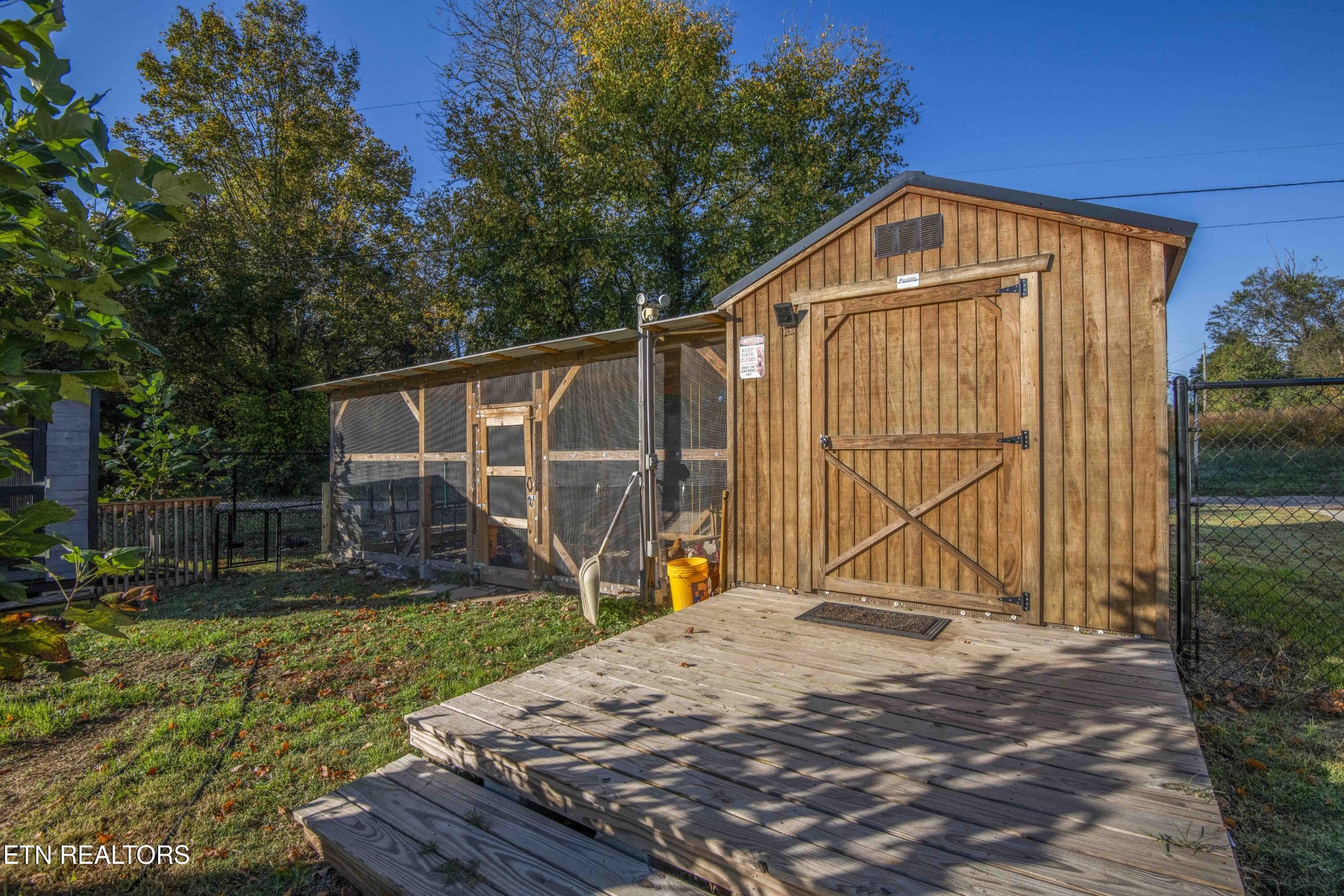 651 Hines Valley Road Lenoir City, TN 37771 - Photo 36 of 44 a view of a backyard with a wooden fence
