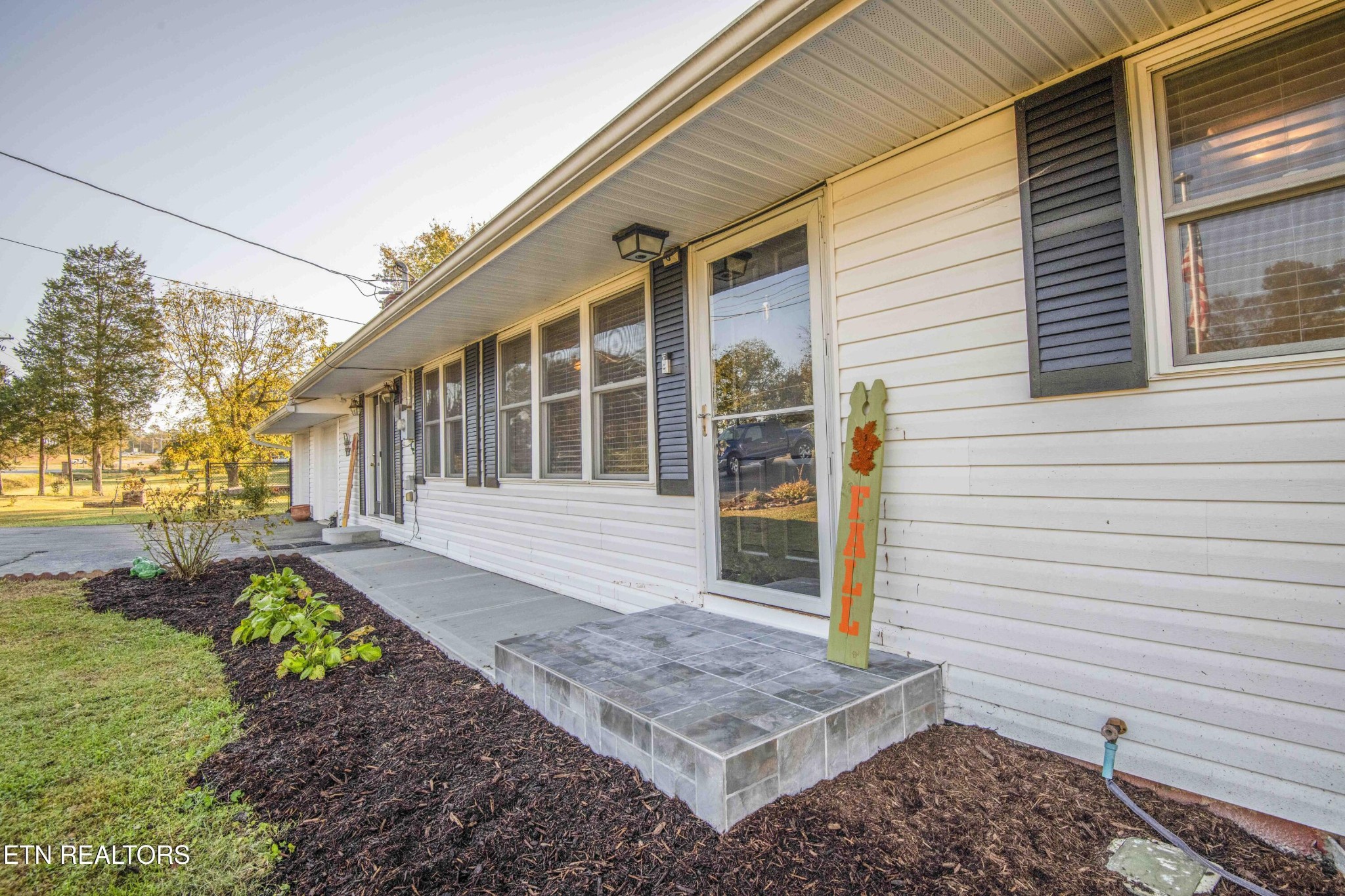 651 Hines Valley Road Lenoir City, TN 37771 - Photo 43 of 44 a front view of a house with garden