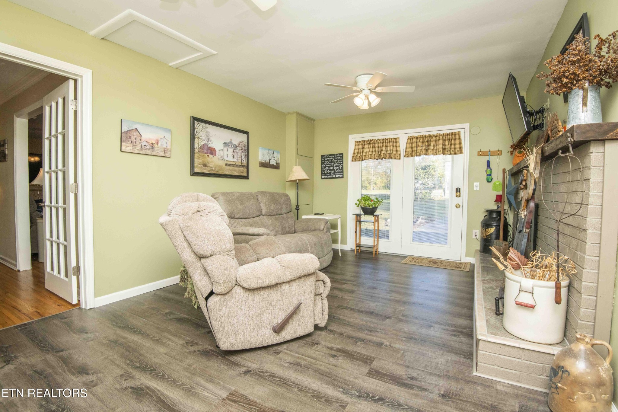 651 Hines Valley Road Lenoir City, TN 37771 - Photo 6 of 44 a living room with furniture and a flat screen tv
