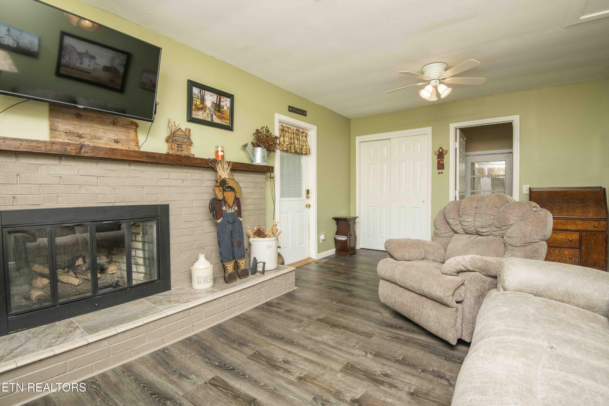 651 Hines Valley Road Lenoir City, TN 37771 - Photo 7 of 44 a living room with furniture and a fireplace