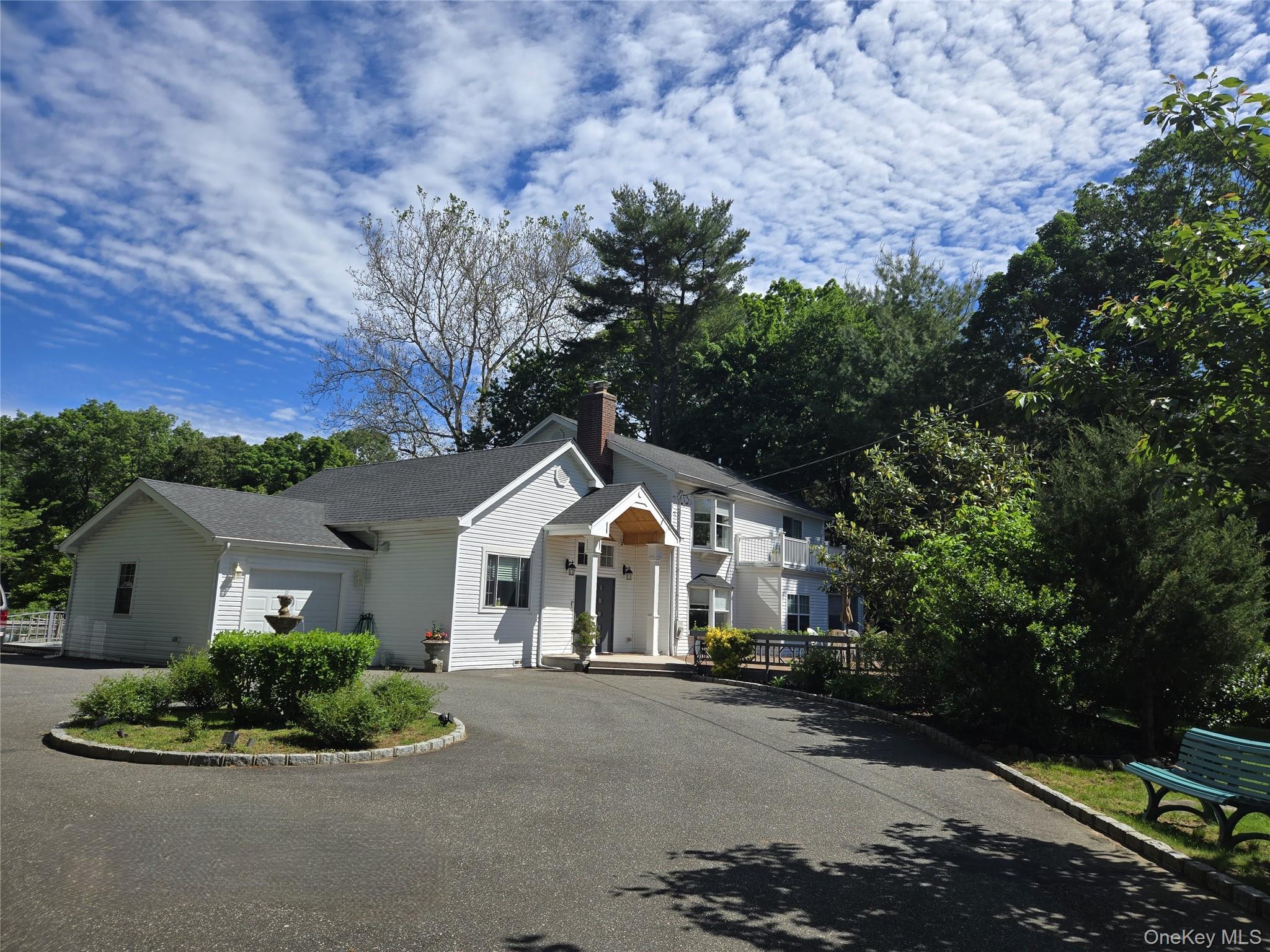 249 Cold Spring Road Syosset, NY 11791 - Photo 1 of 28 a front view of a house with a yard
