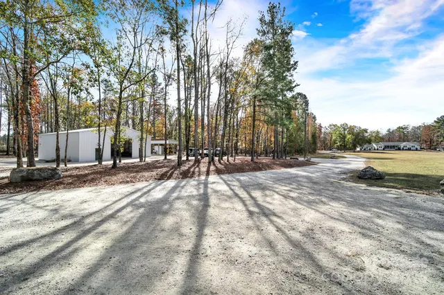 a view of outdoor space with swimming pool and patio