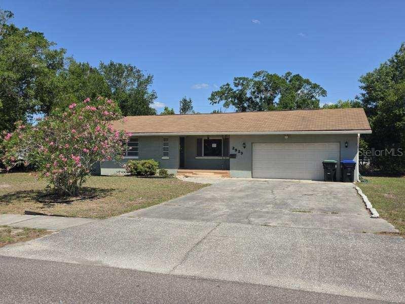 2523 Falkner Road Orlando, FL 32810 - Photo 1 of 1 front view of a house with a yard
