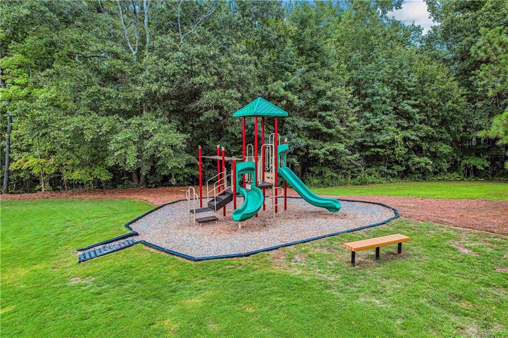 215 Coffee Lane Hoschton, GA 30548 - Photo 28 of 34 a view of a park with slide
