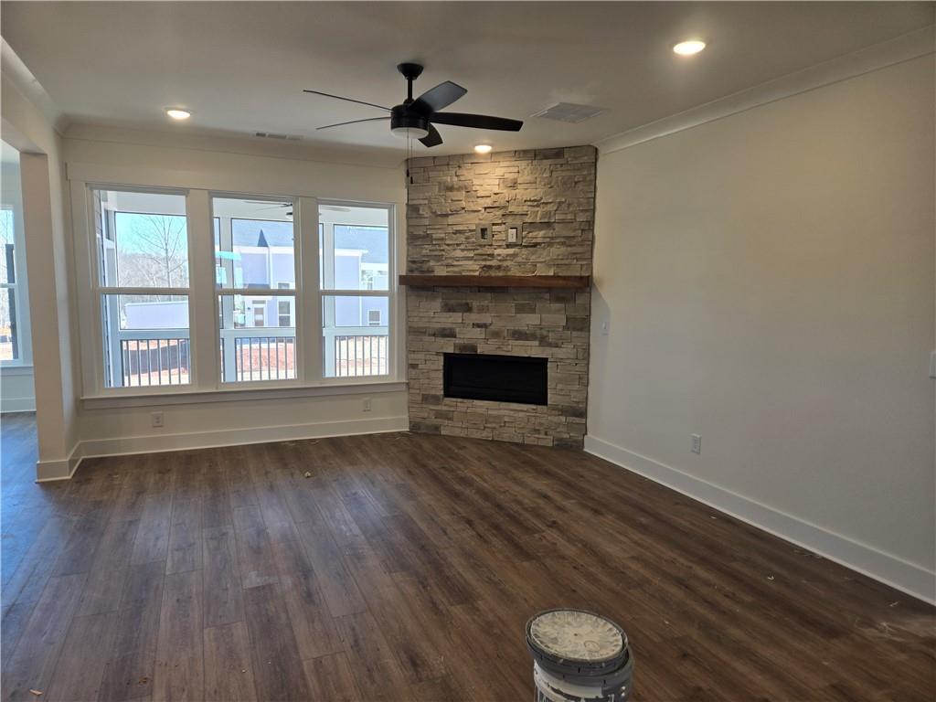 215 Coffee Lane Hoschton, GA 30548 - Photo 10 of 34 a view of an empty room with wooden floor and a window