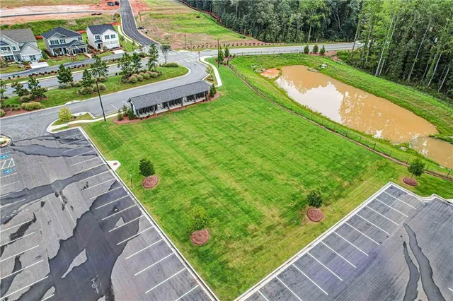 a view of a yard with potted plants