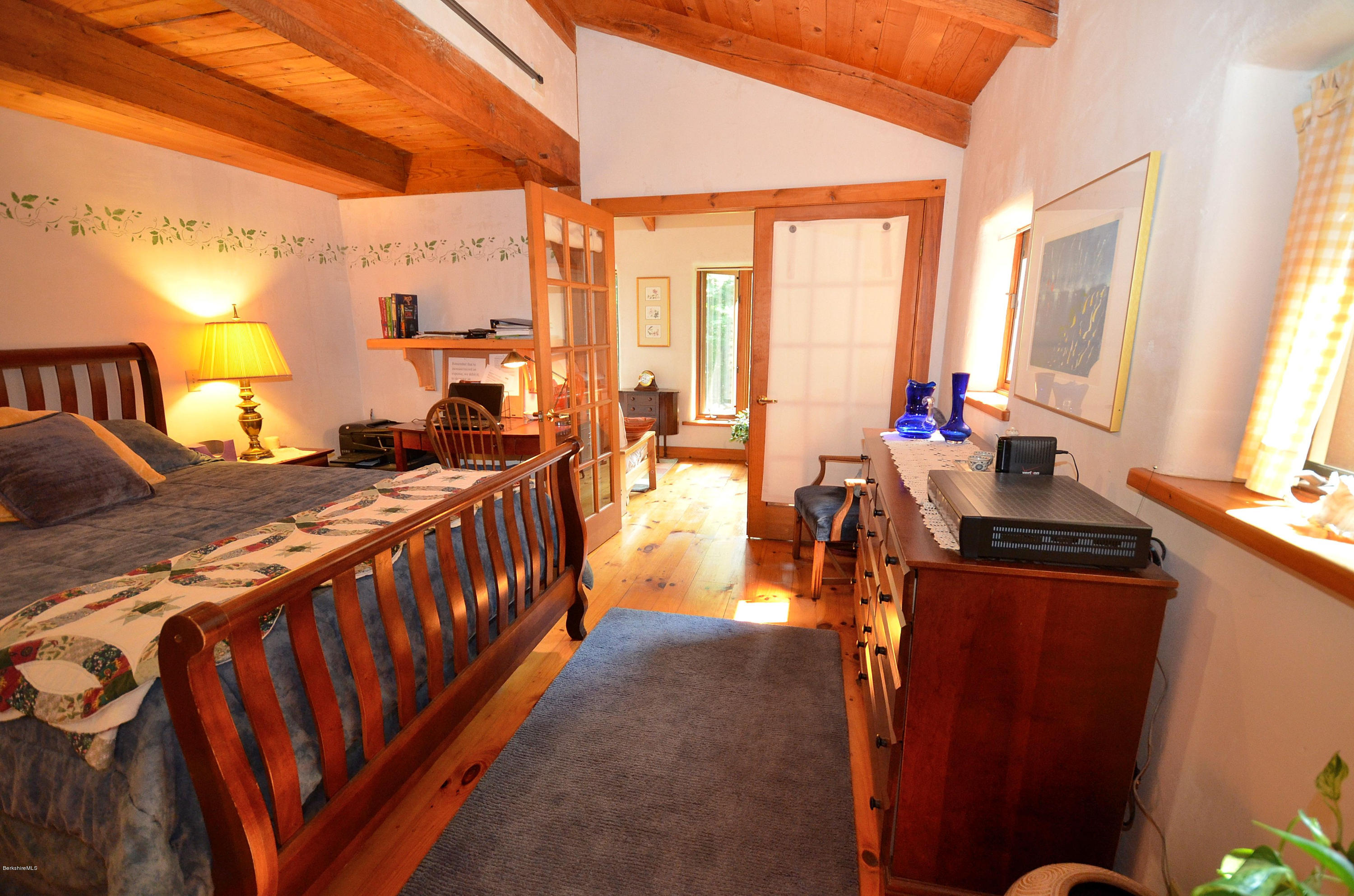 509 Middlefield Road Washington, MA 01223 - Photo 14 of 29 a bedroom with furniture and large windows