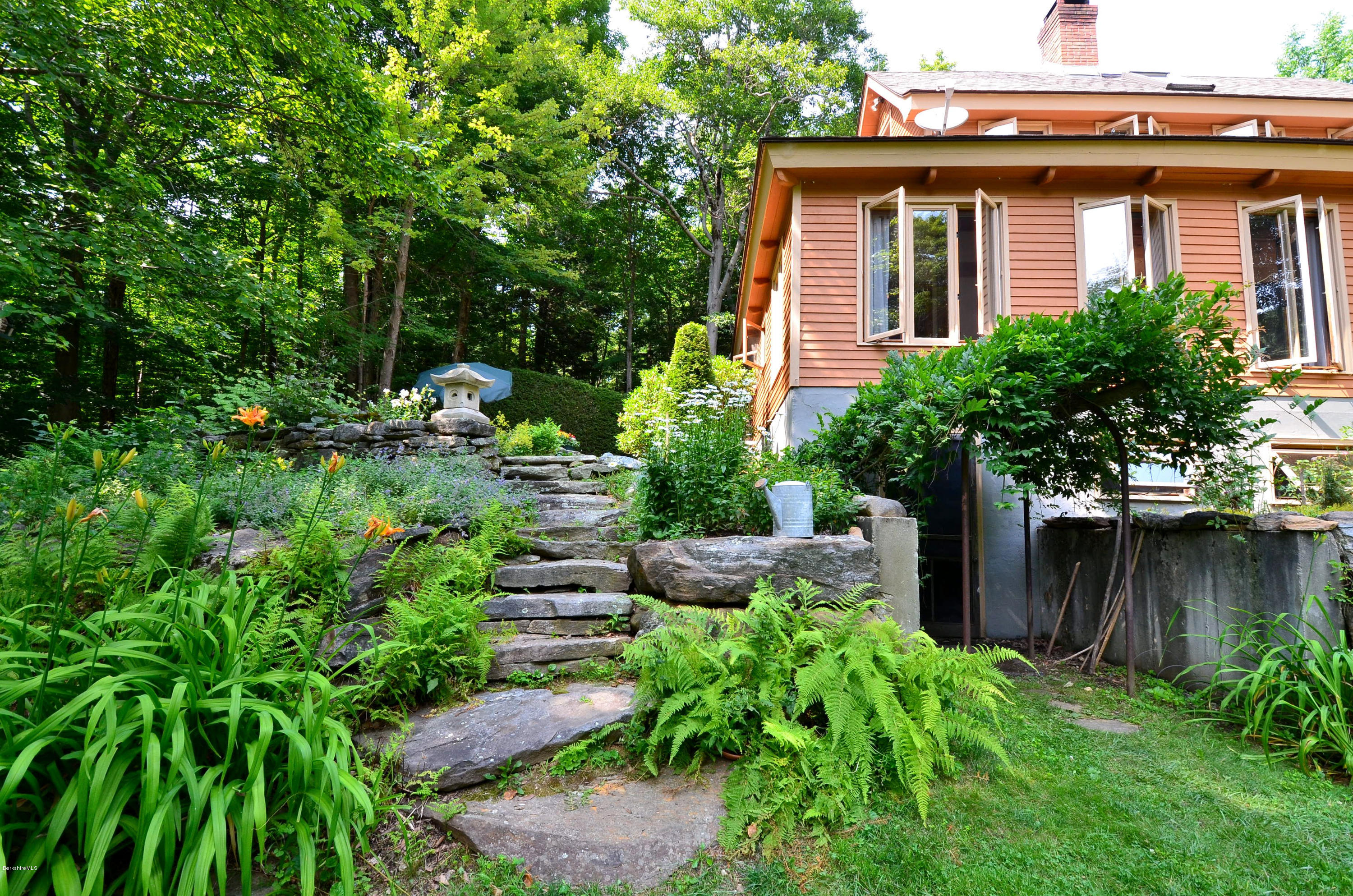 509 Middlefield Road Washington, MA 01223 - Photo 22 of 29 a view of a house with a yard plants and large tree