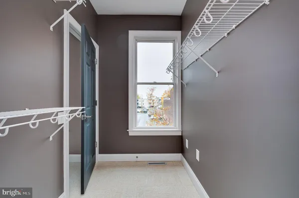 a view of room with window and hardwood floor