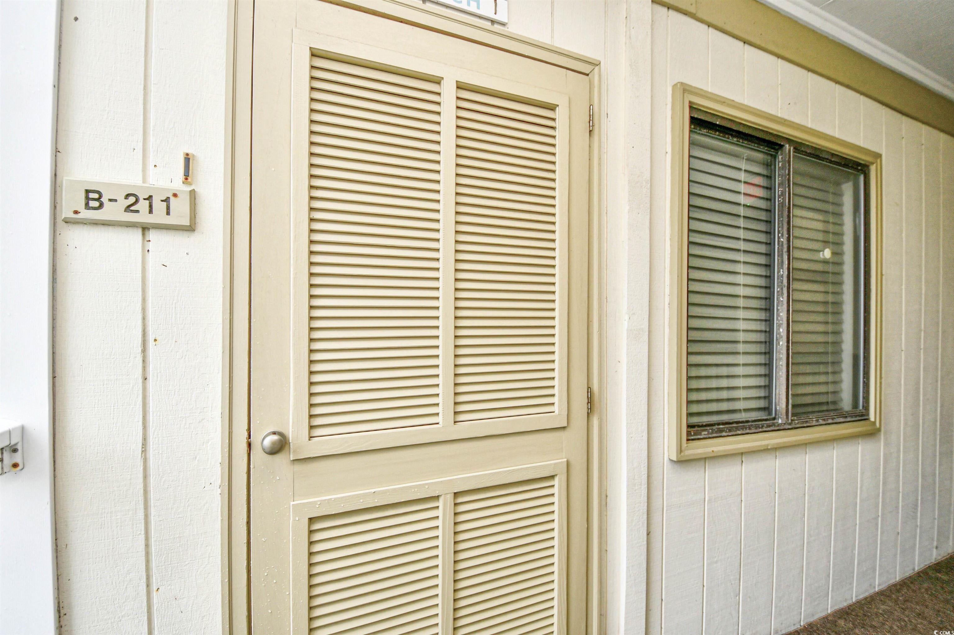 191 Maison Drive, Unit B211 Myrtle Beach, SC 29572 - Photo 2 of 35 Exterior view of wood walls