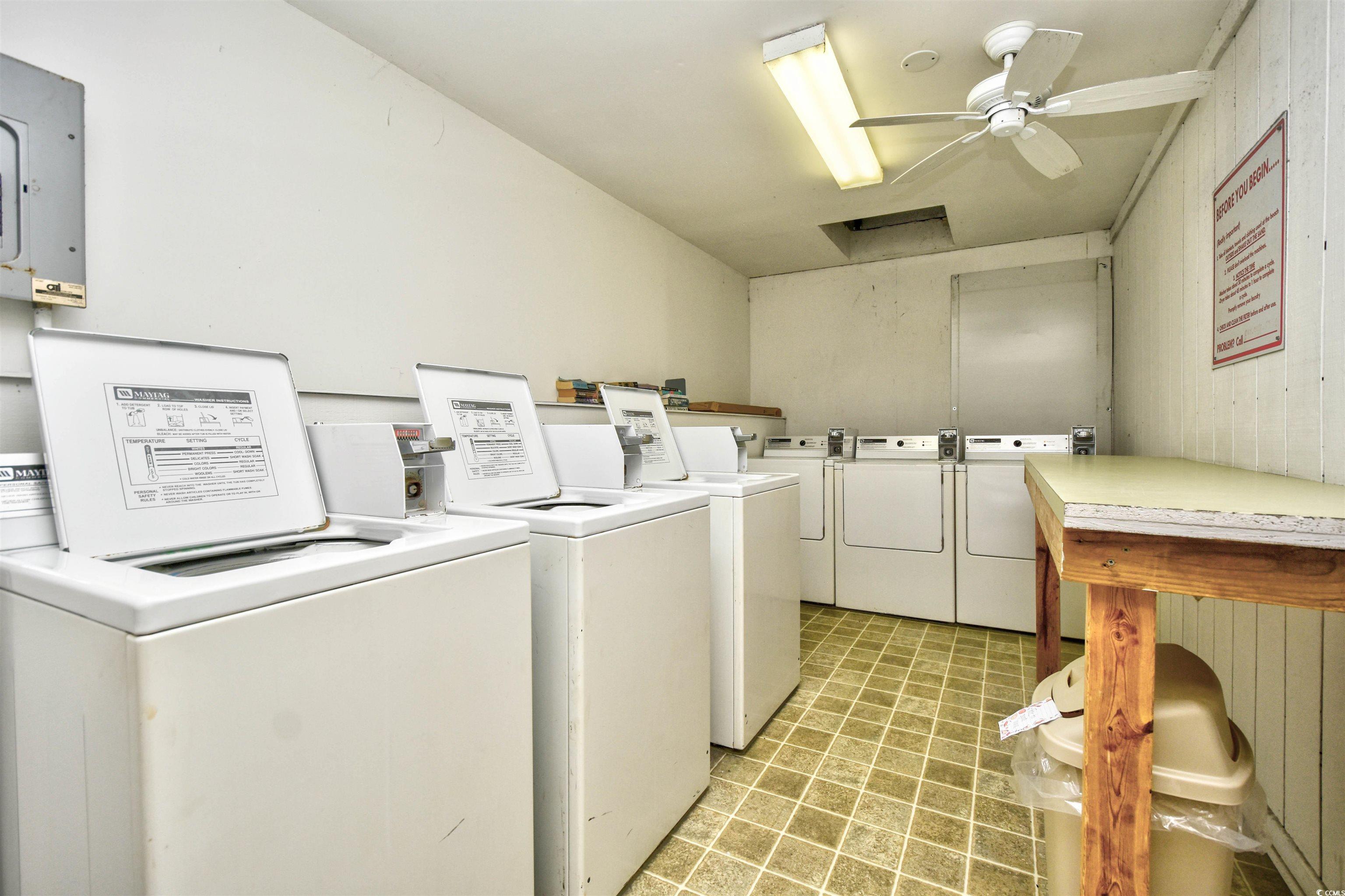 191 Maison Drive, Unit B211 Myrtle Beach, SC 29572 - Photo 26 of 35 Shared laundry room with independent washer and dryer, electric panel, ceiling fan, and light flooring