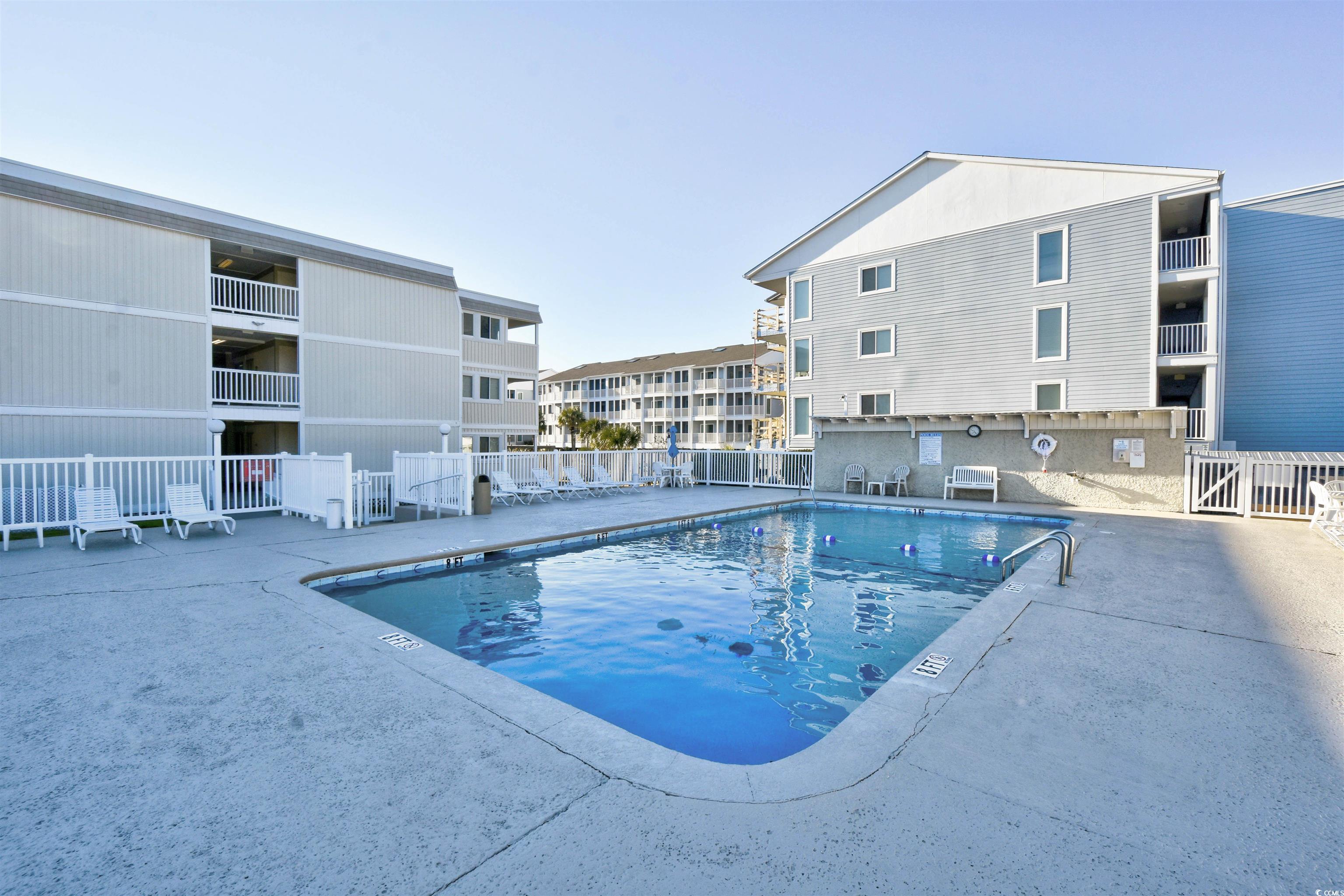 191 Maison Drive, Unit B211 Myrtle Beach, SC 29572 - Photo 30 of 35 Community pool with a patio