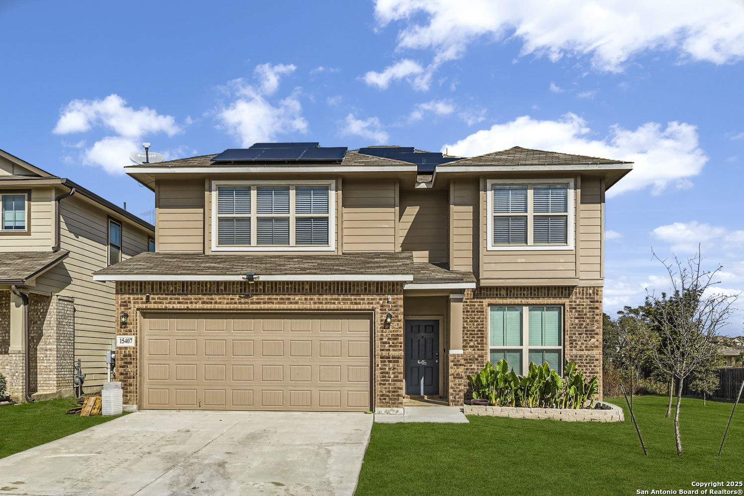 a front view of a house with a yard