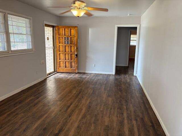 4803 43rd Street Lubbock, TX 79414 - Photo 2 of 4 a view of an empty room with wooden floor and a window