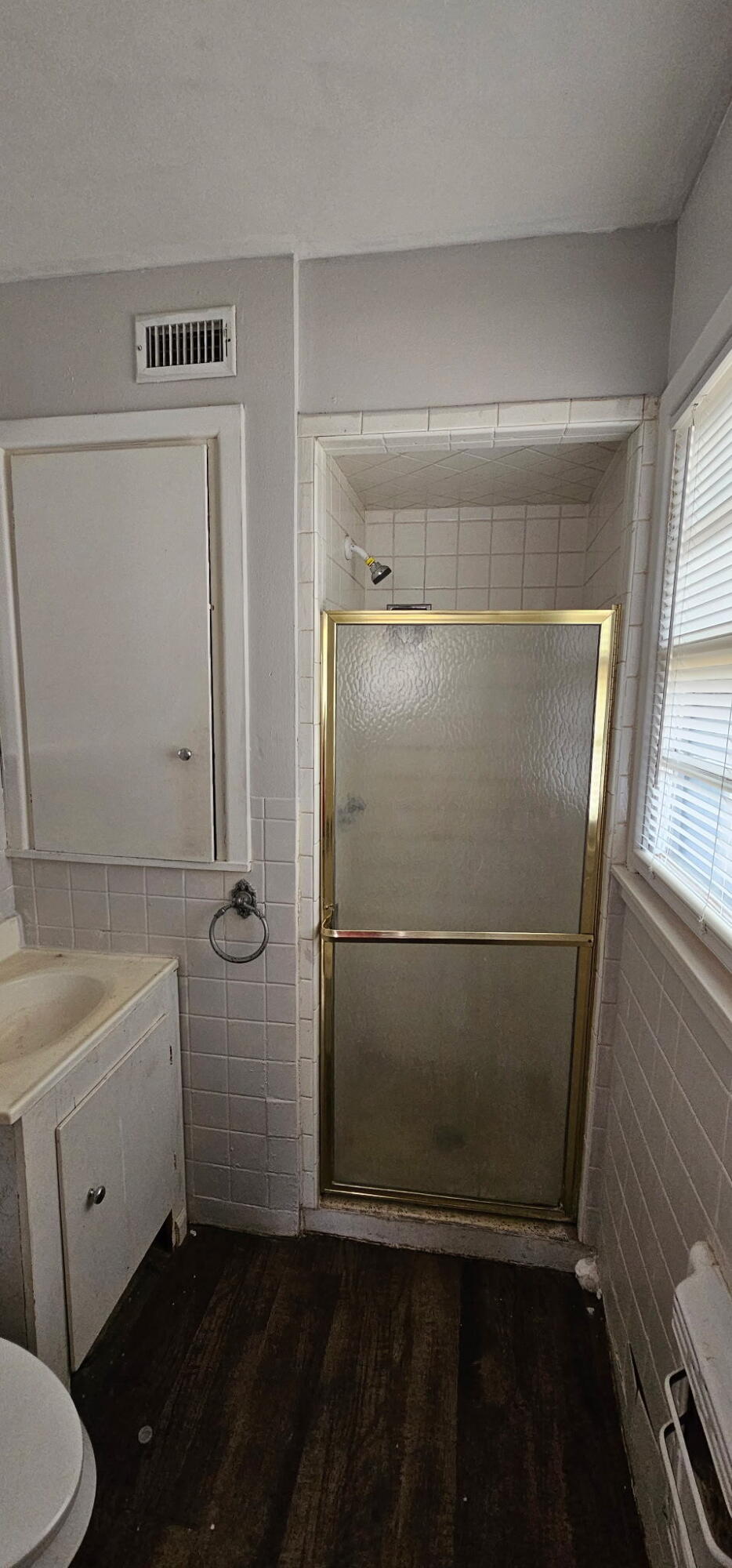 4803 43rd Street Lubbock, TX 79414 - Photo 4 of 4 a bathroom with a sink toilet and shower